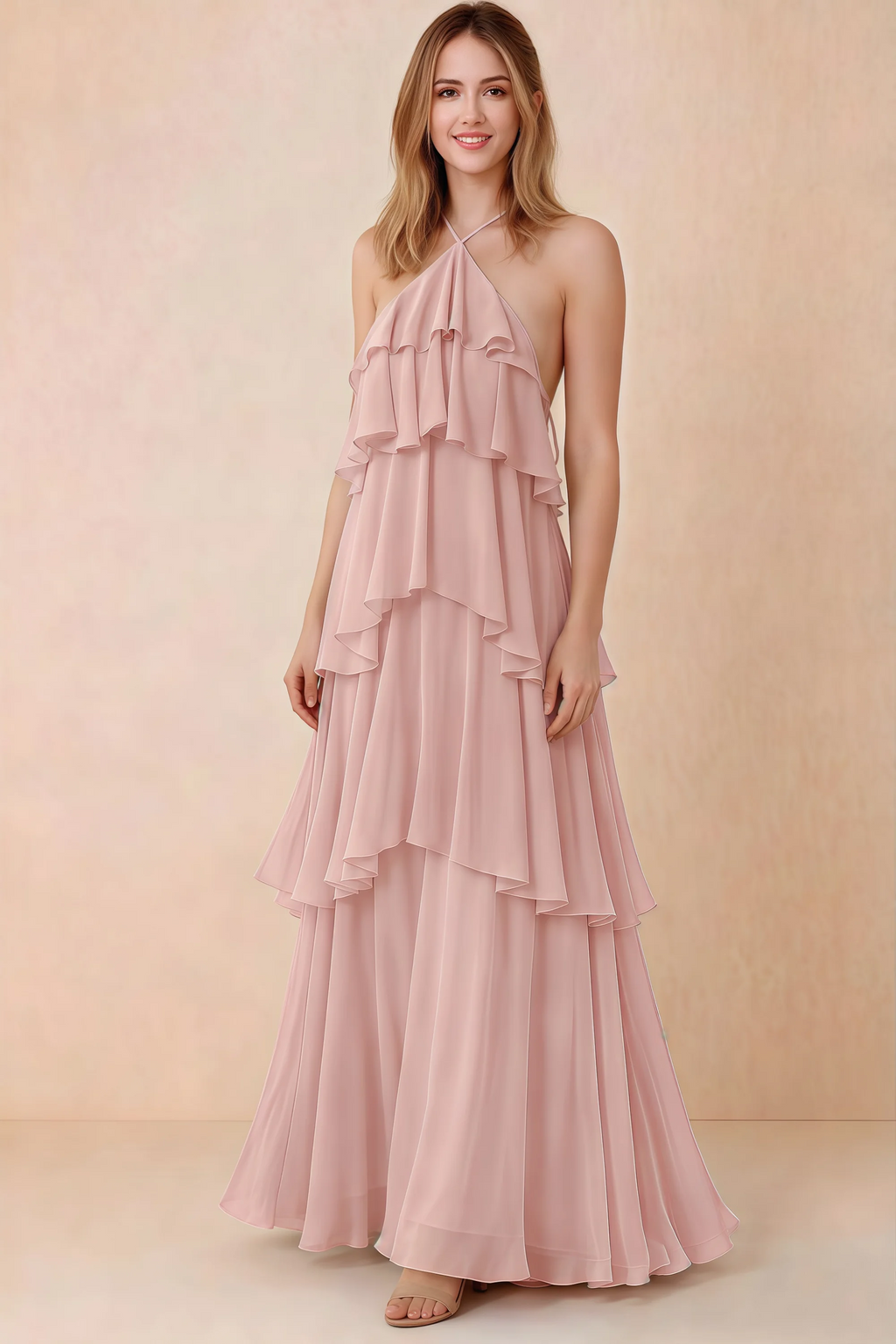 Front view of Audrey powder pink chiffon maxi dress with crossed halter straps and cascading tiered ruffles