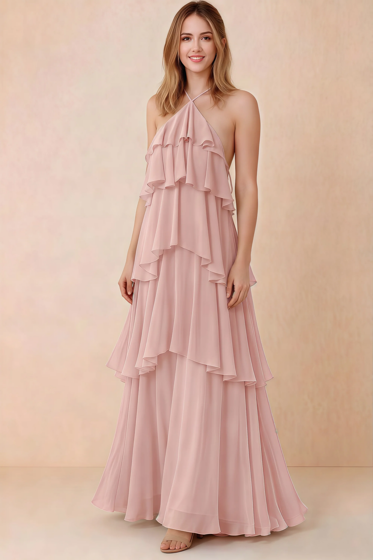 Front view of Audrey powder pink chiffon maxi dress with crossed halter straps and cascading tiered ruffles