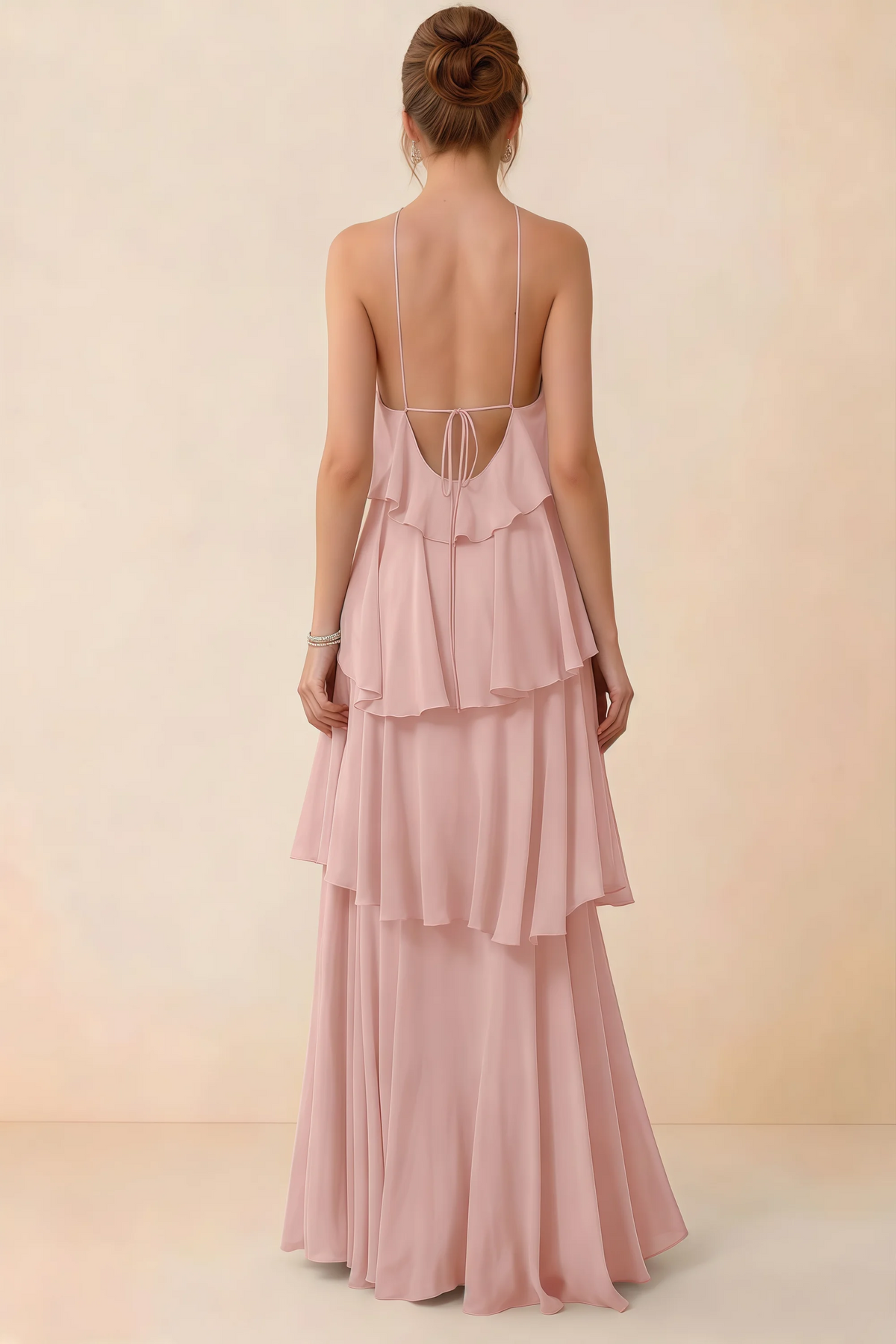 Back view of Audrey powder pink ruffle maxi dress showing a low open back and fine tie straps