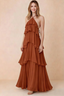 Front view of Audrey rust chiffon maxi dress with crossed halter straps and cascading tiered ruffles