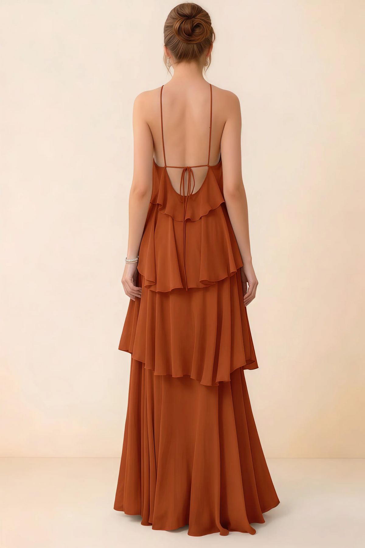Back view of Audrey rust ruffle maxi dress showing a low open back and fine tie straps