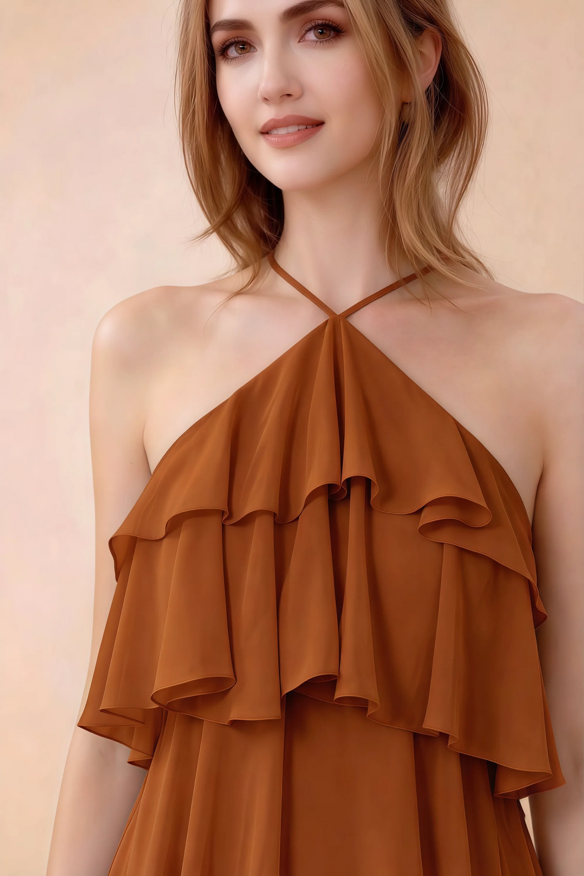 Close-up of Audrey rust crossed halter neckline and soft chiffon ruffles