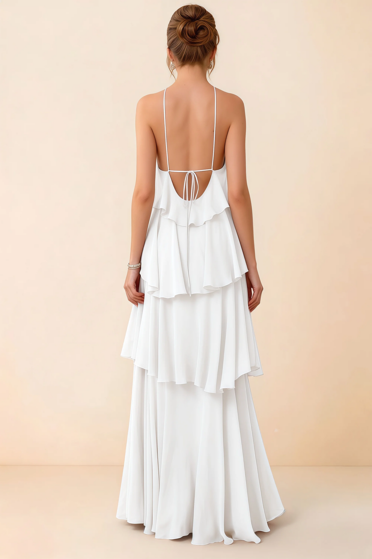 Back view of Audrey white ruffle maxi dress showing a low open back and fine tie straps