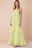 Front view of Audrey yellow chiffon maxi dress with crossed halter straps and cascading tiered ruffles