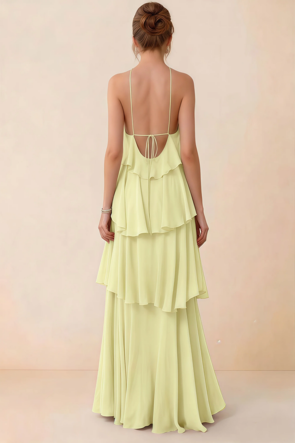 Back view of Audrey yellow ruffle maxi dress showing a low open back and fine tie straps