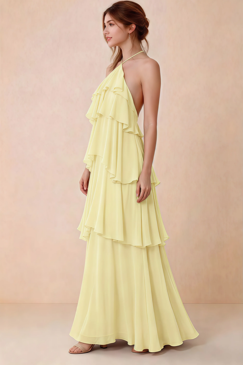 Side view of Audrey yellow chiffon dress showing the relaxed shape and layered ruffles