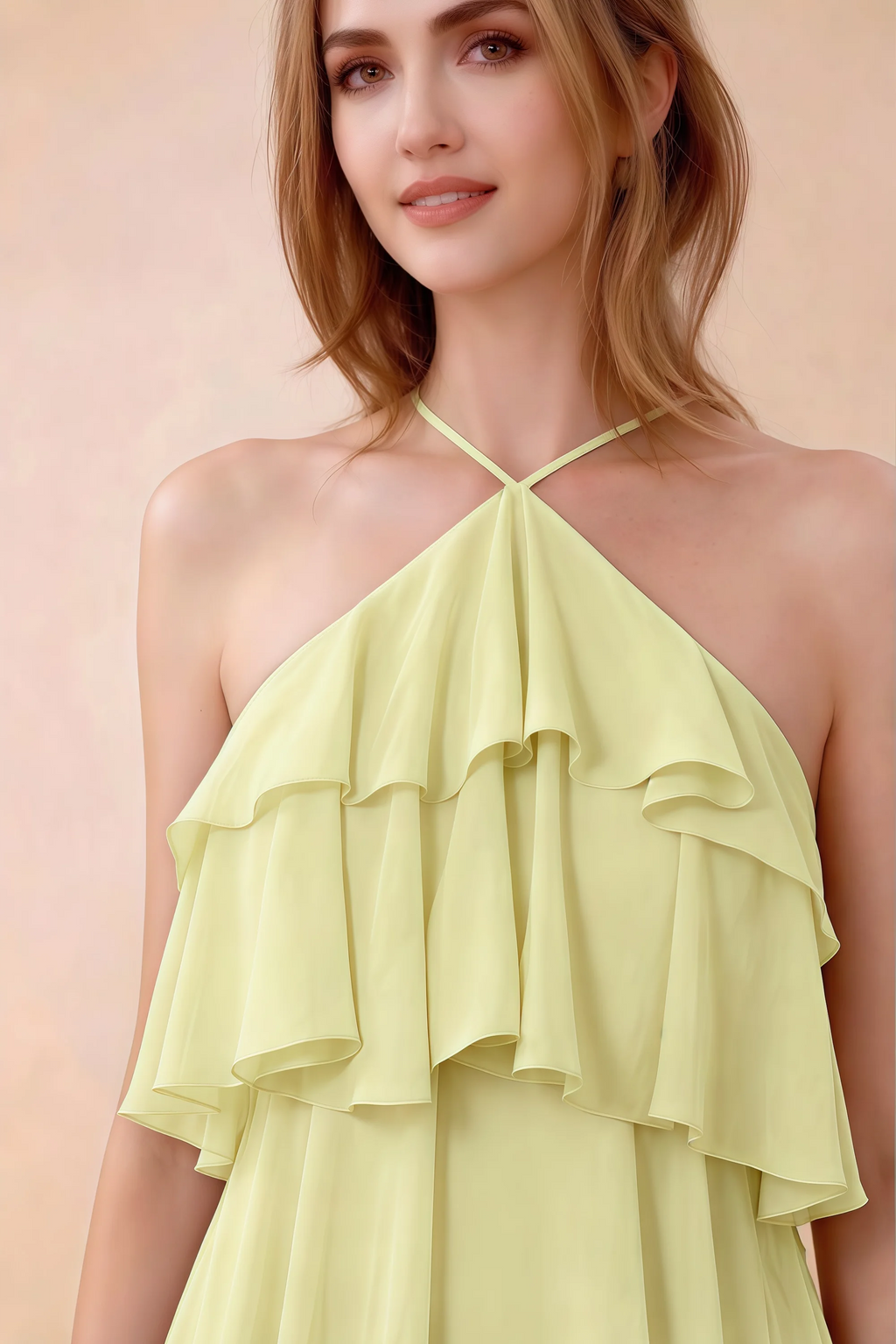 Close-up of Audrey yellow crossed halter neckline and soft chiffon ruffles