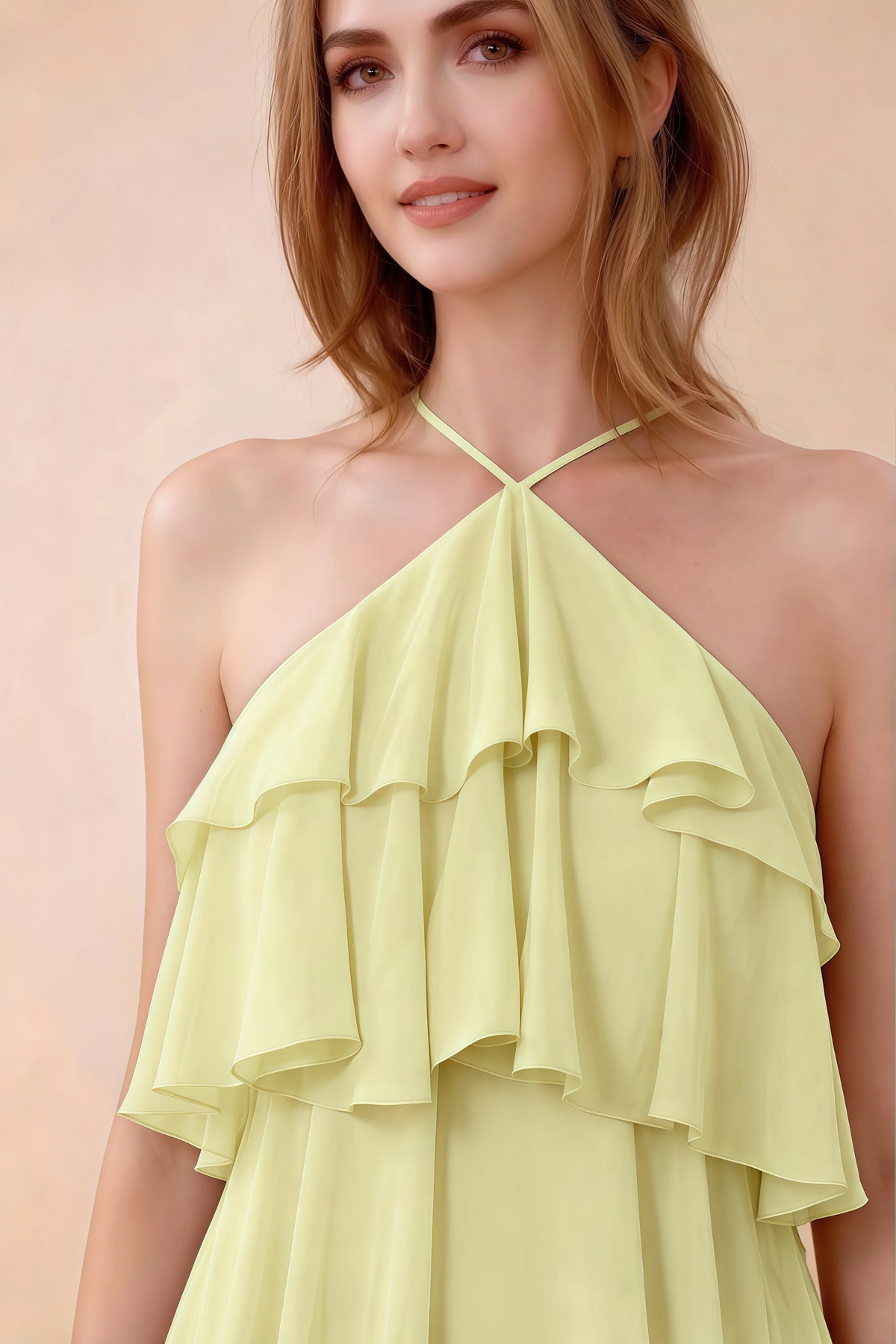 Close-up of Audrey yellow crossed halter neckline and soft chiffon ruffles