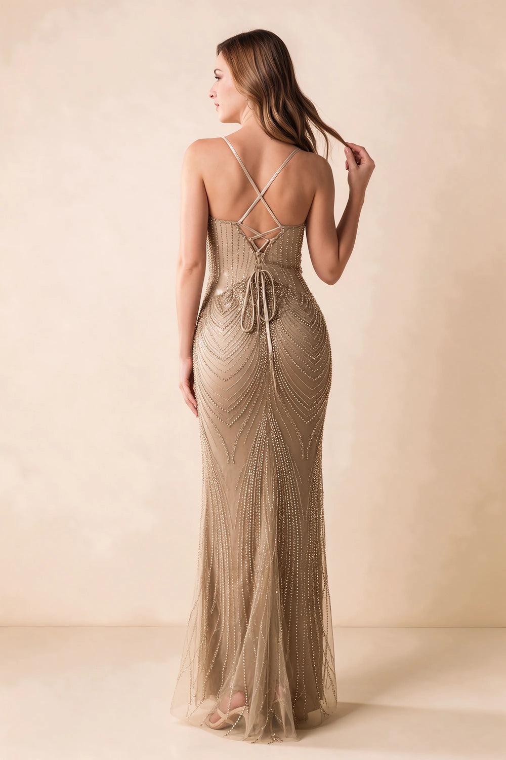Translation missing: en.Back view of the Augusta champagne maxi dress showing crossed straps, lace-up ties and a flared hem. content.product_image_secondary