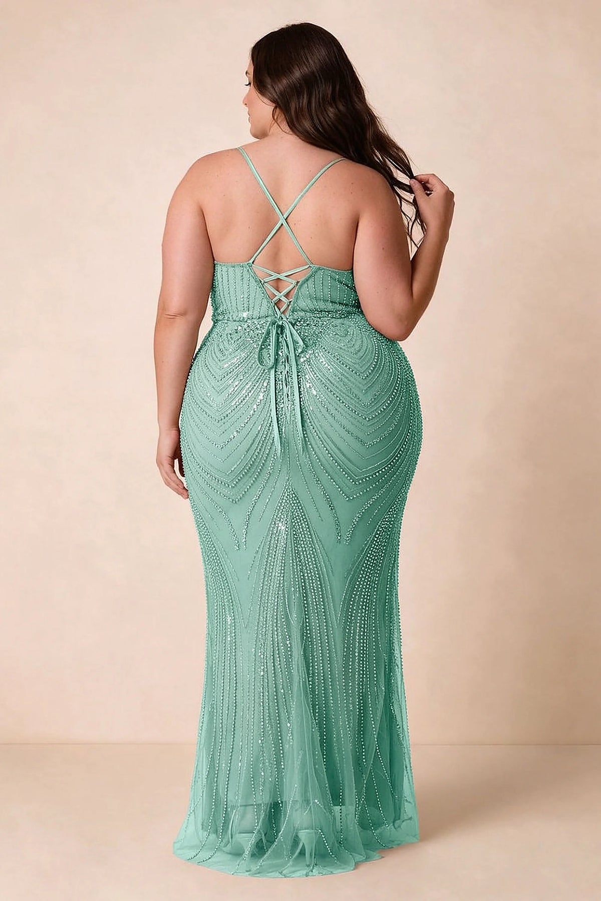 Back view on a second model of the Augusta lake blue dress, showing crisscross straps and tie fastening.