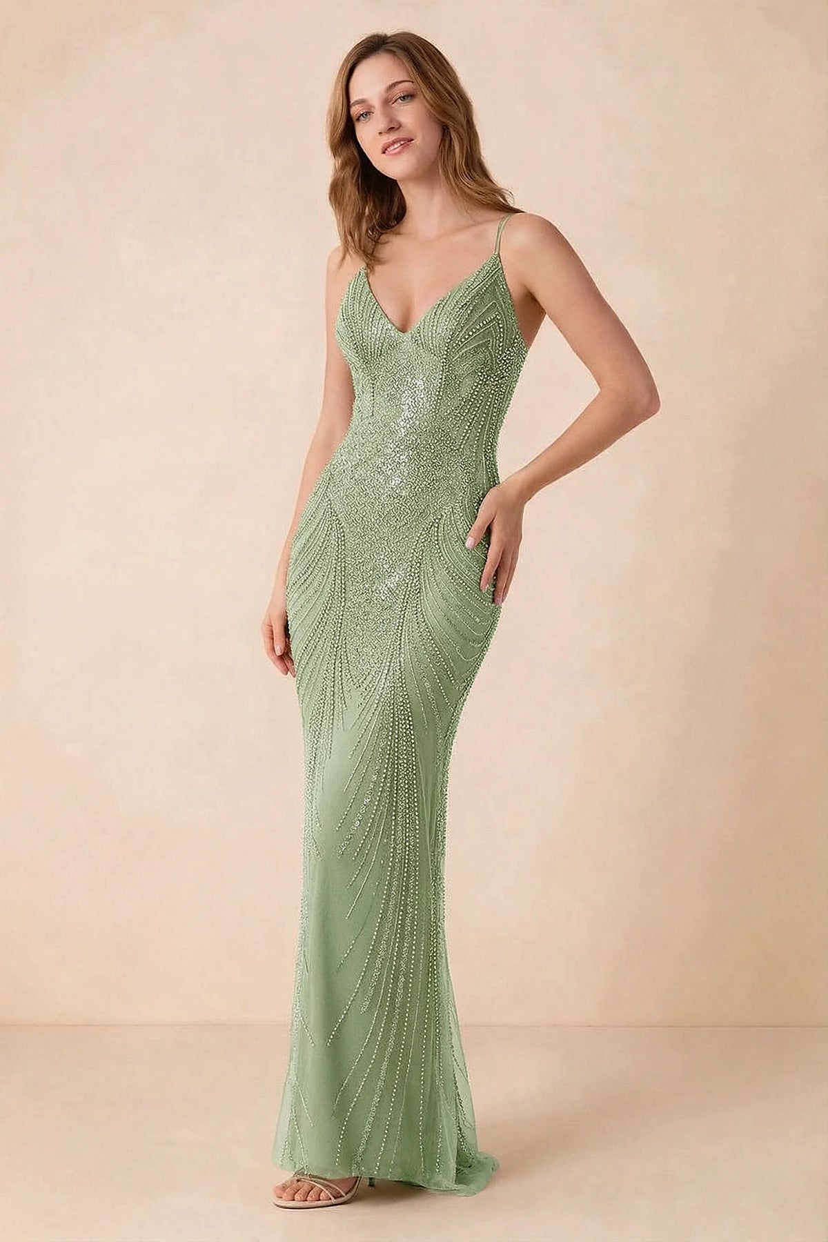 Front view of the Augusta light green beaded mermaid maxi dress with a V-neckline and thin shoulder straps.
