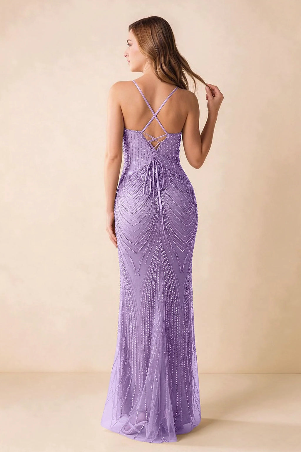Back view of the Augusta lilac maxi dress showing crossed straps, lace-up ties and a flared hem.