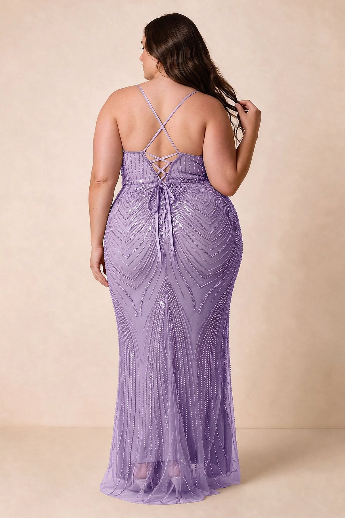 Back view on a second model of the Augusta lilac dress, showing crisscross straps and tie fastening.