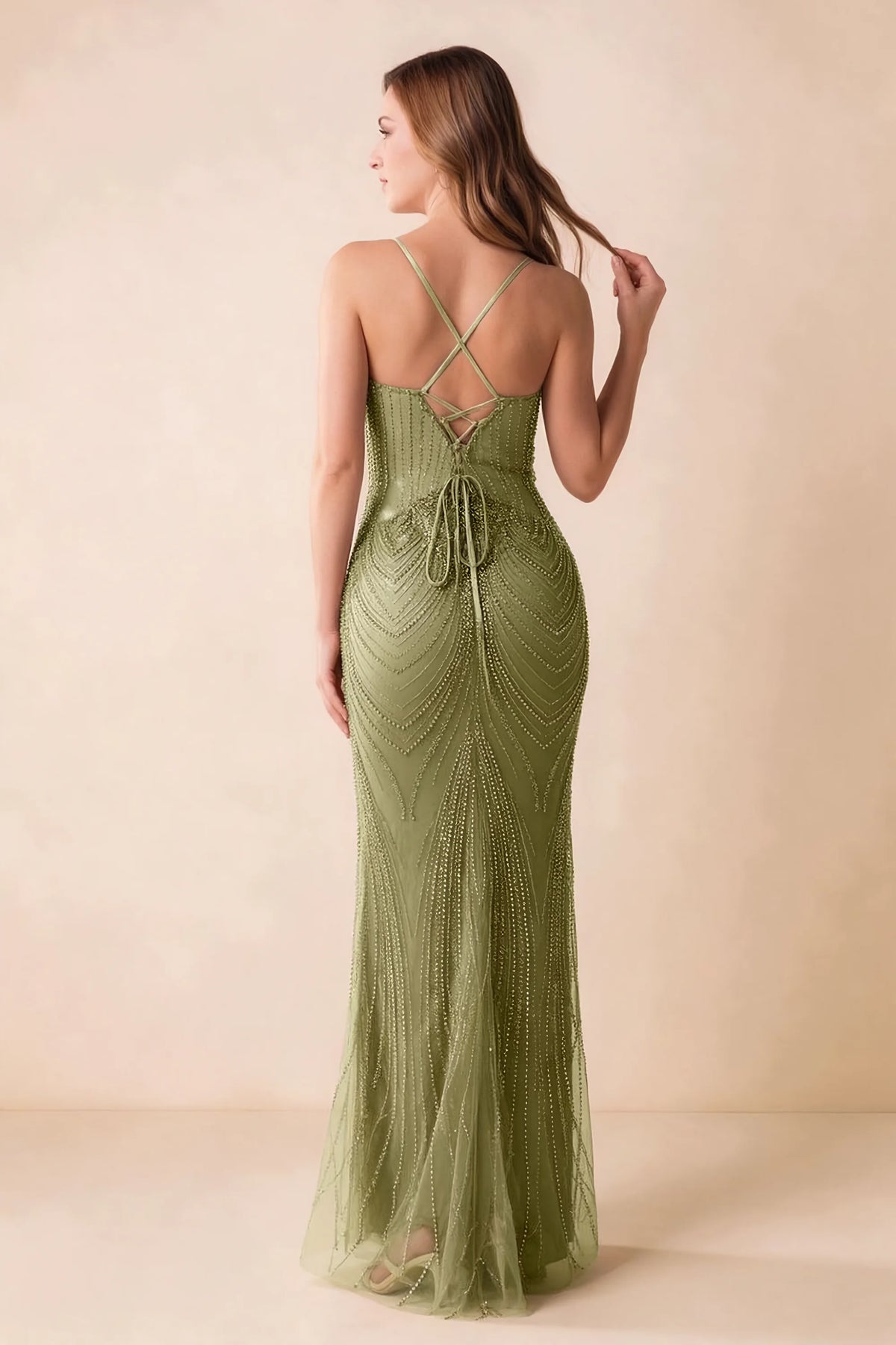Back view of the Augusta olive maxi dress showing crossed straps, lace-up ties and a flared hem.