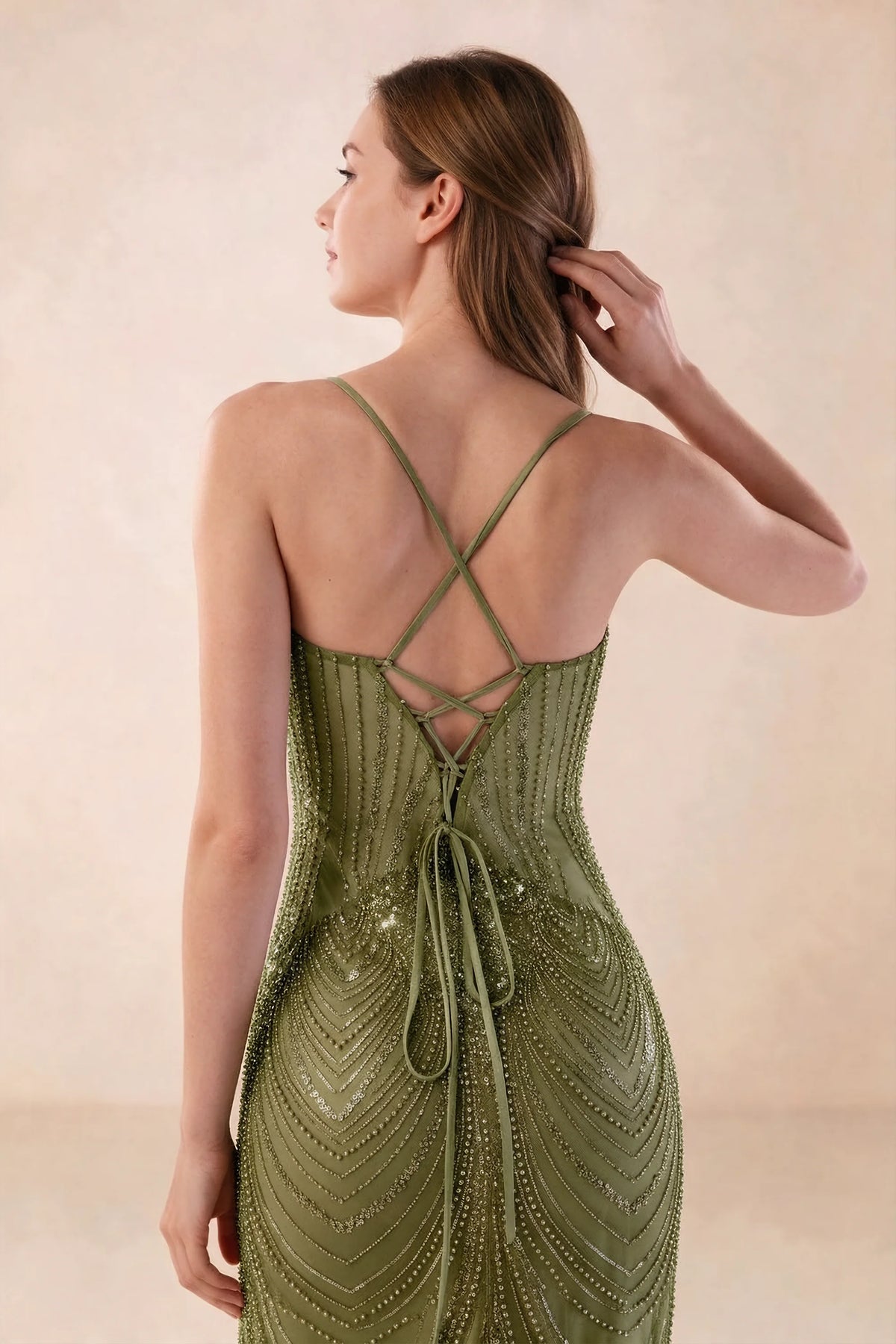Close-up of the Augusta olive open back, crossed straps and lace-up tie detail.