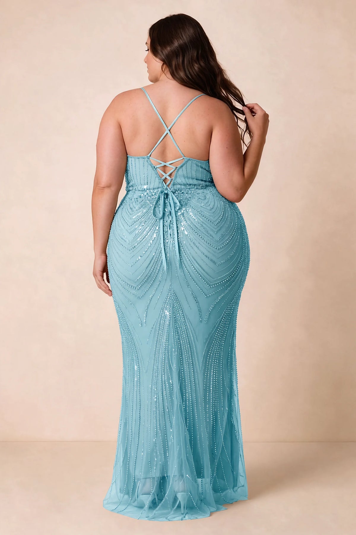 Back view on a second model of the Augusta sky blue dress, showing crisscross straps and tie fastening.