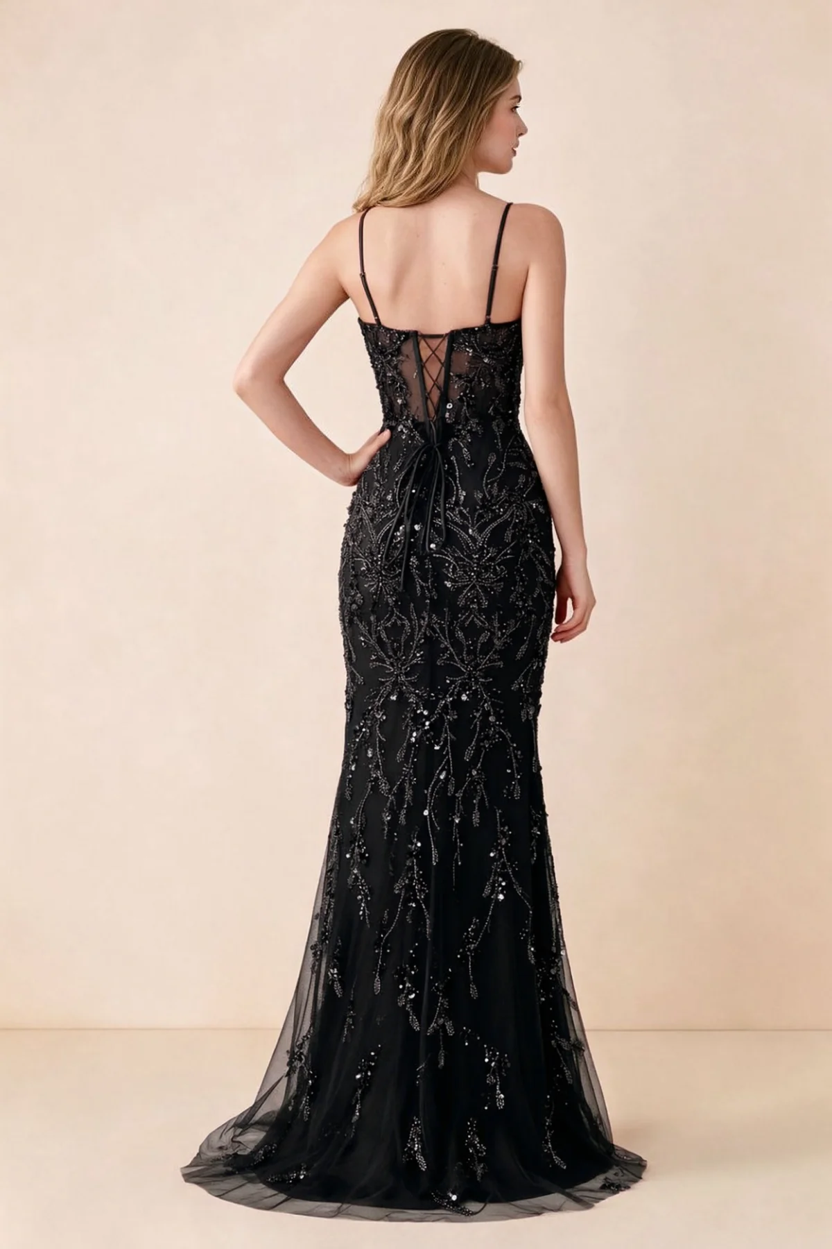 Back view of Aurelia black maxi dress showing spaghetti straps and crossed waist lacing