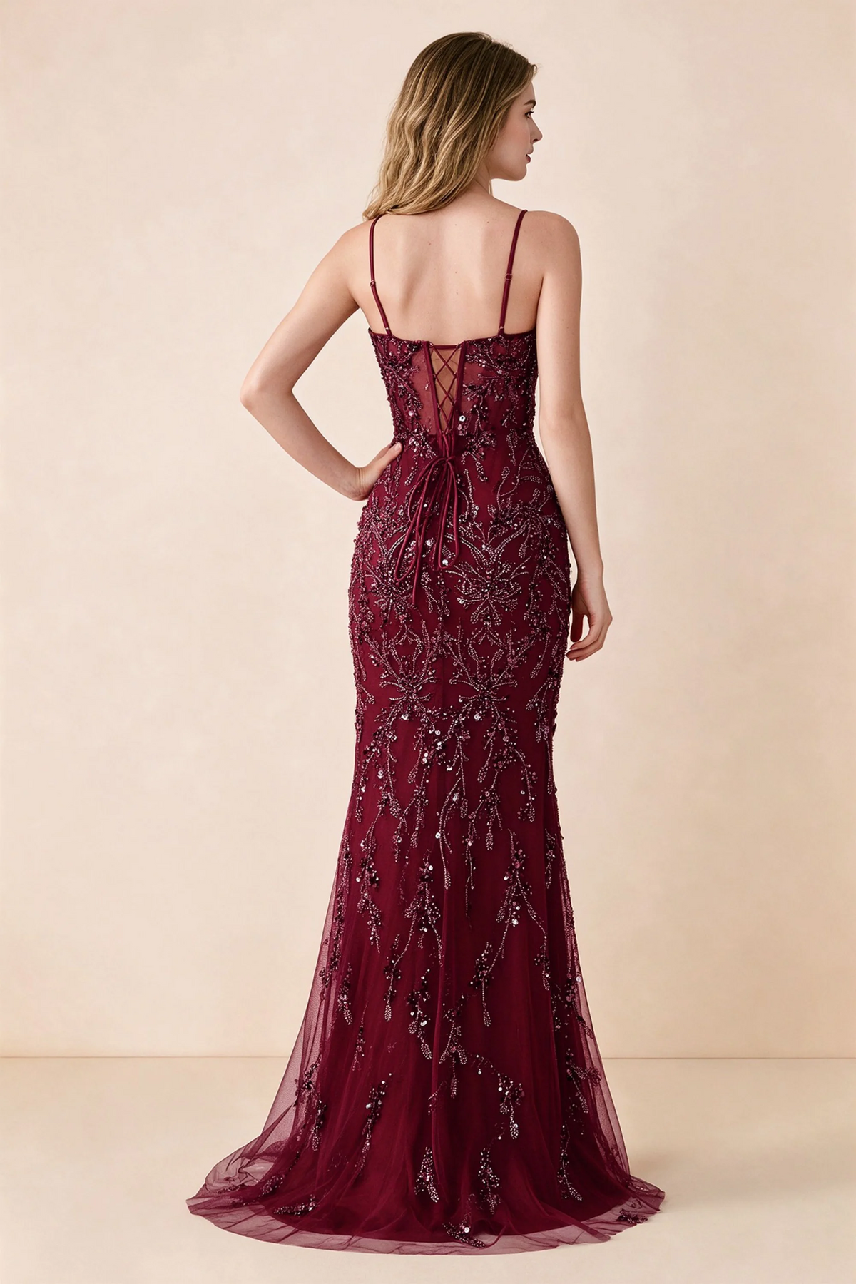 Back view of Aurelia burgundy maxi dress showing spaghetti straps and crossed waist lacing