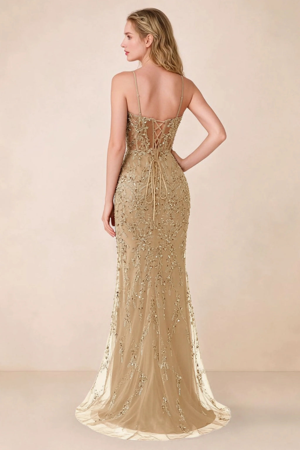 Back view of Aurelia champagne maxi dress showing spaghetti straps and crossed waist lacing