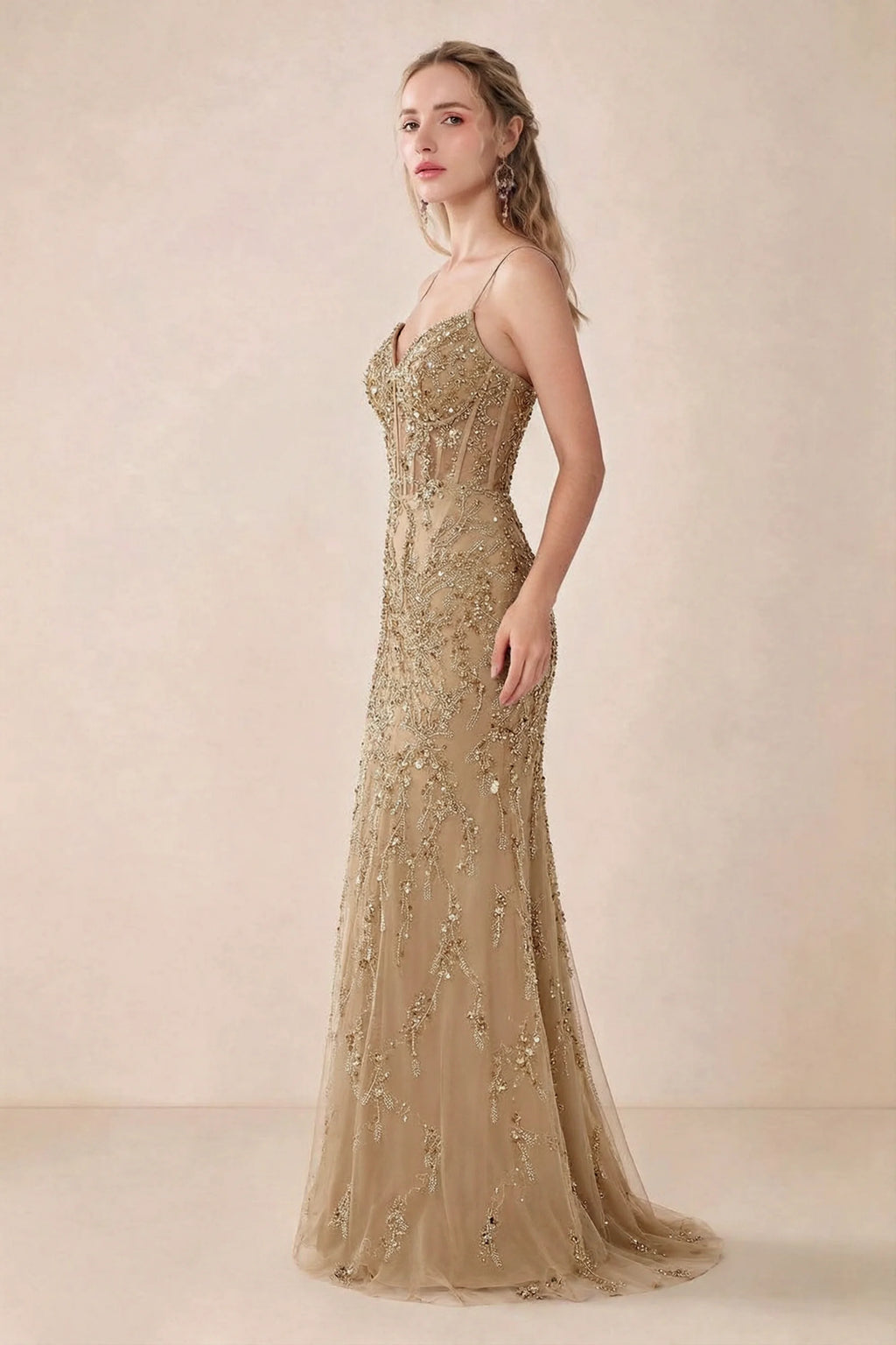 Side view of Aurelia champagne sequin maxi dress showing the fitted hips and flared hem