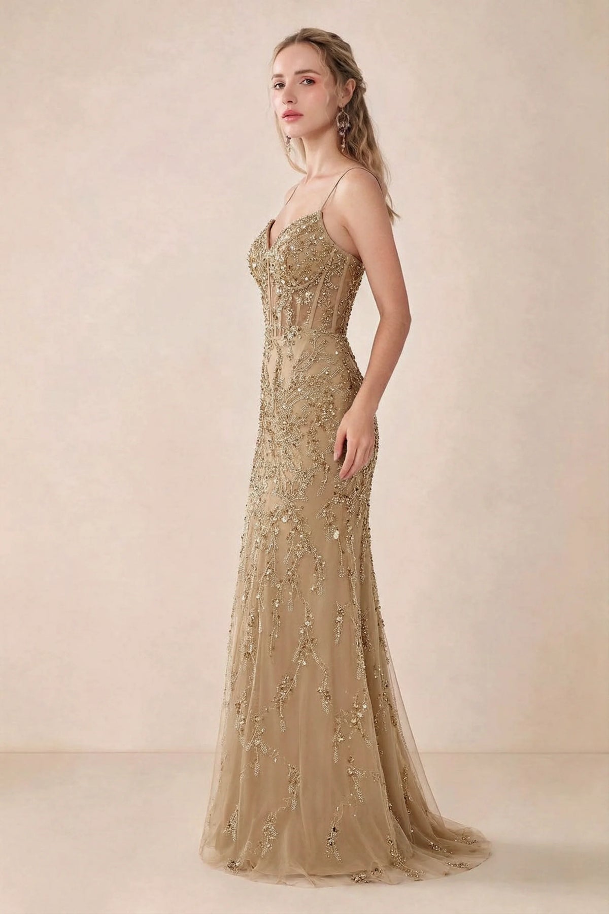 Side view of Aurelia champagne sequin maxi dress showing the fitted hips and flared hem