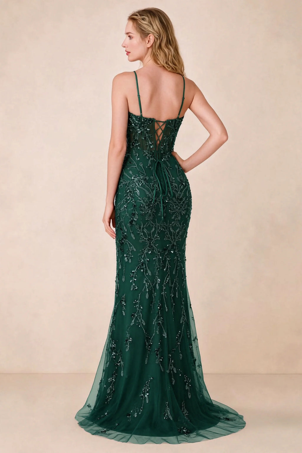 Back view of Aurelia dark green maxi dress showing spaghetti straps and crossed waist lacing