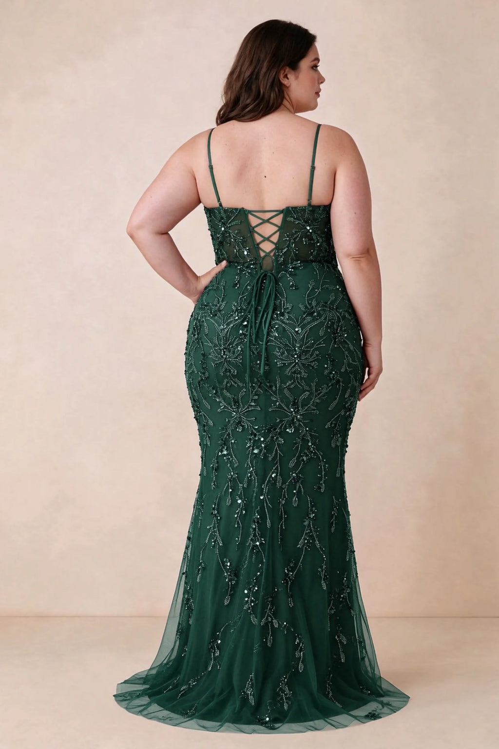Back view on a second model showing the Aurelia dark green corset dress and waist lacing