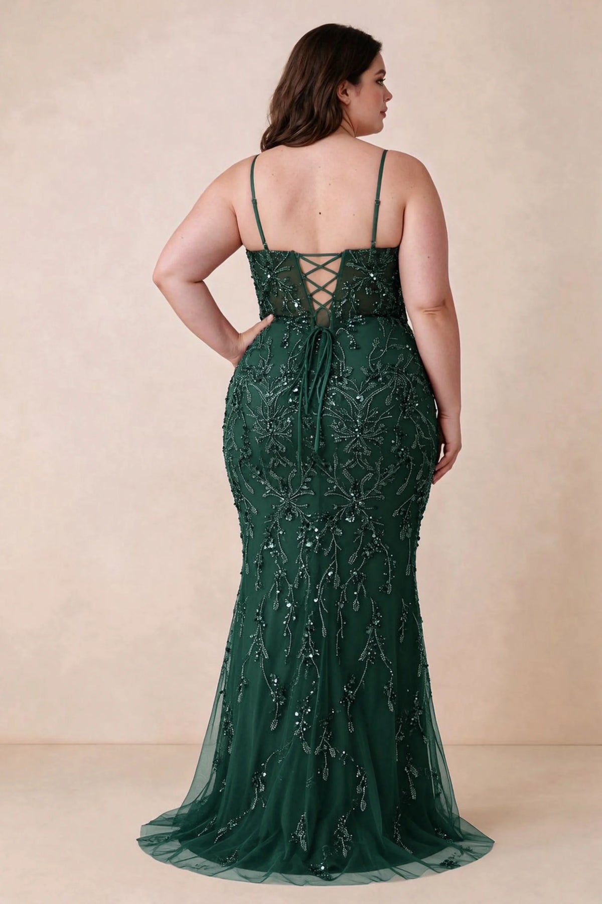 Back view on a second model showing the Aurelia dark green corset dress and waist lacing