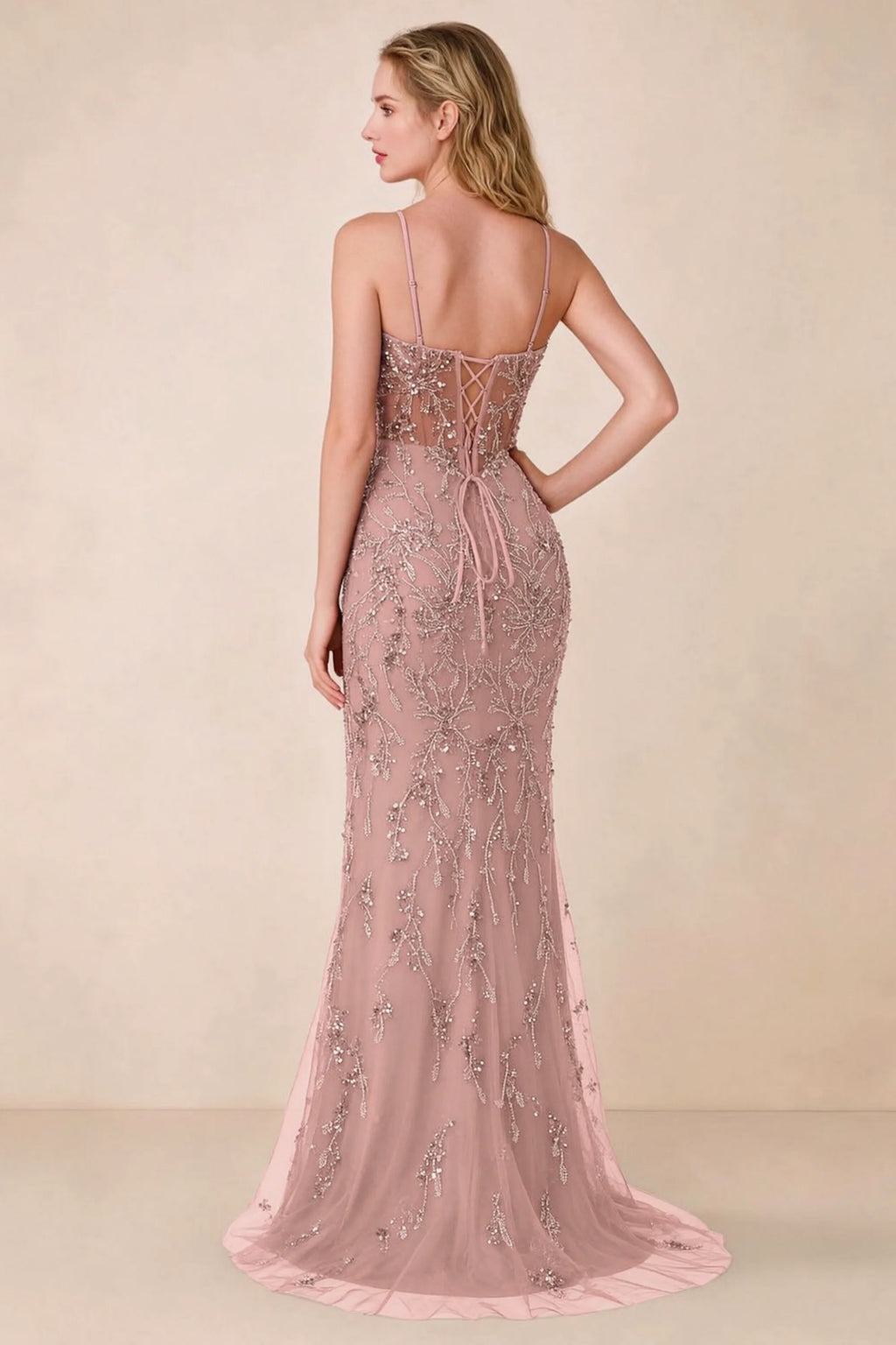 Back view of Aurelia light pink maxi dress showing spaghetti straps and crossed waist lacing