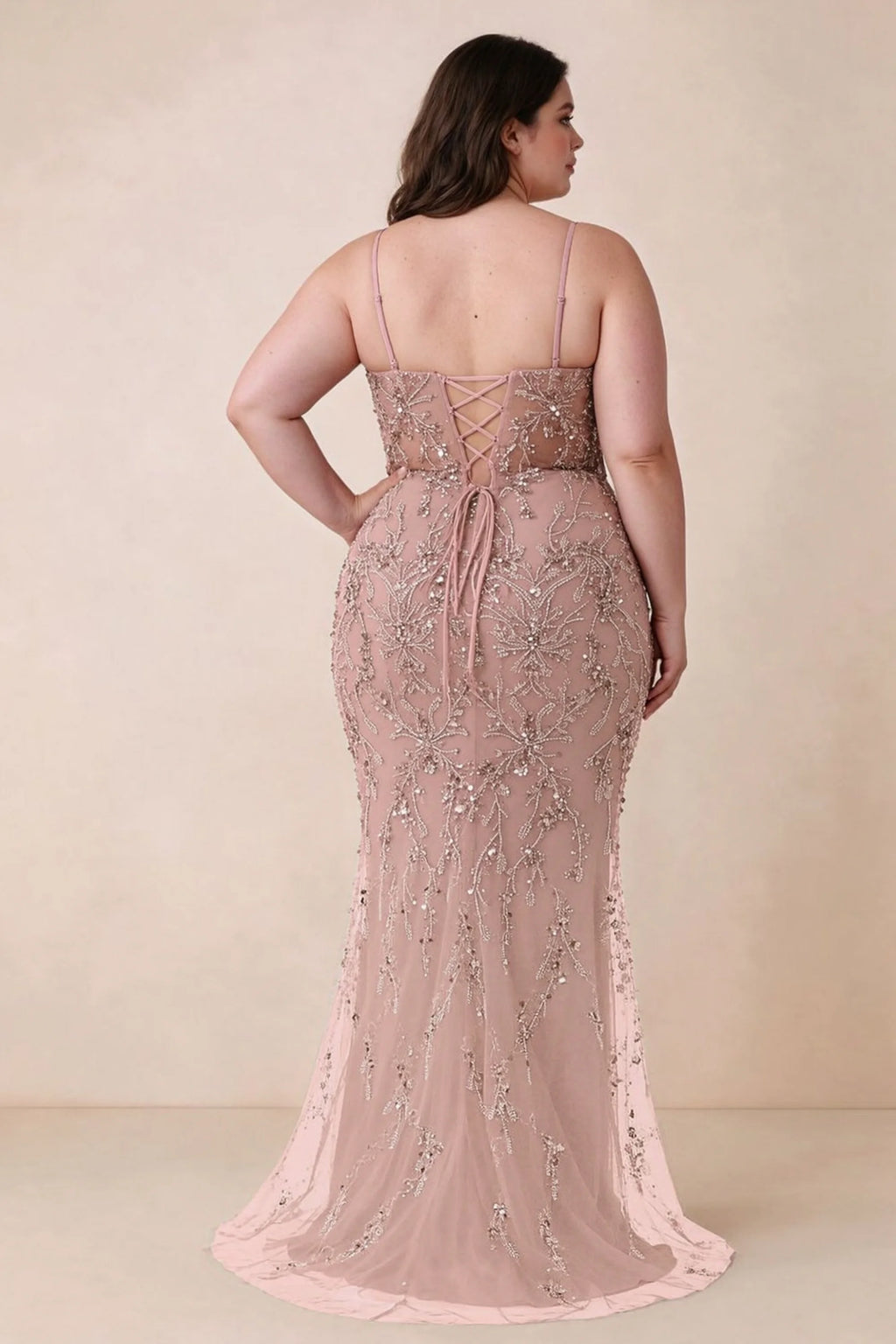 Back view on a second model showing the Aurelia light pink corset dress and waist lacing