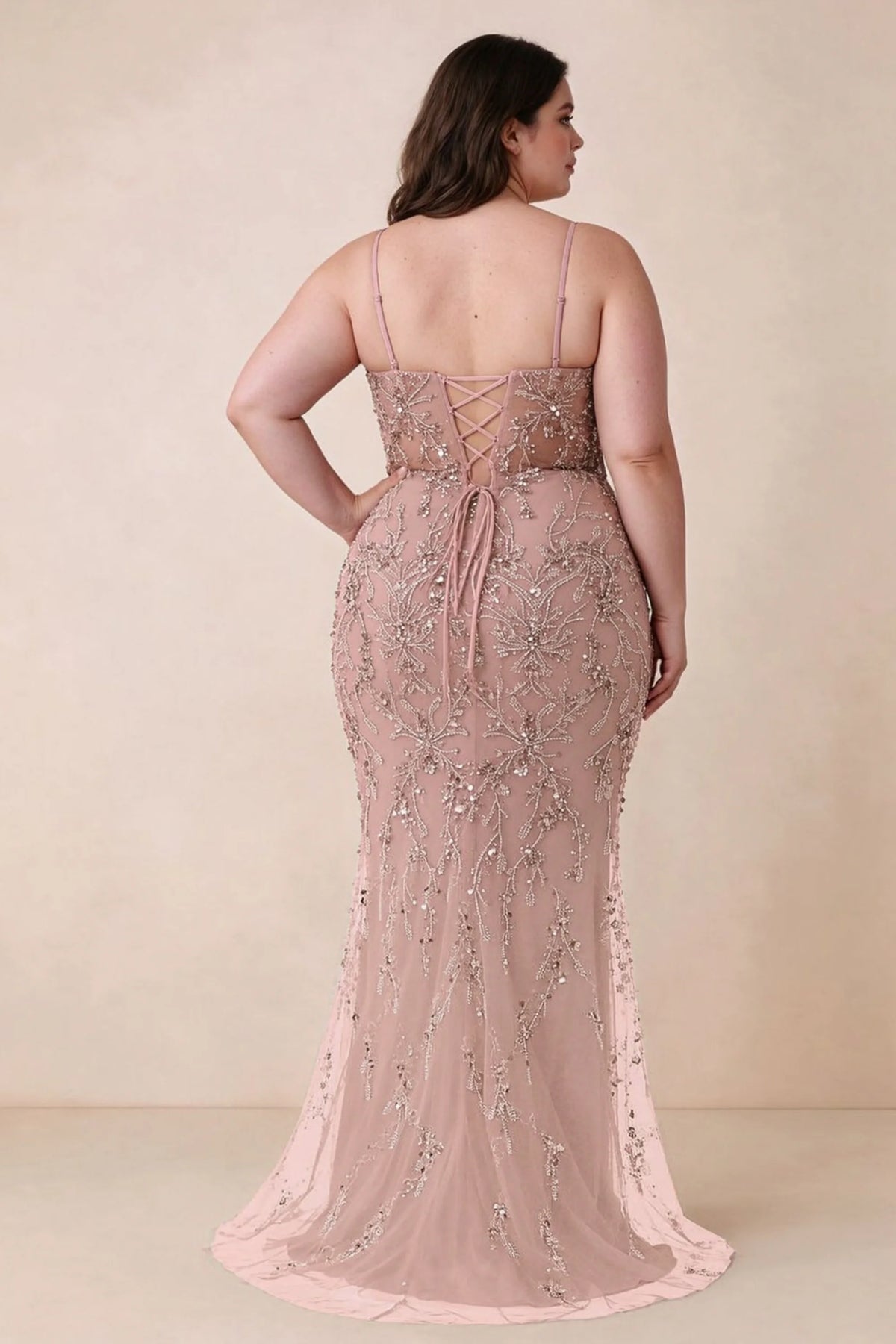 Back view on a second model showing the Aurelia light pink corset dress and waist lacing