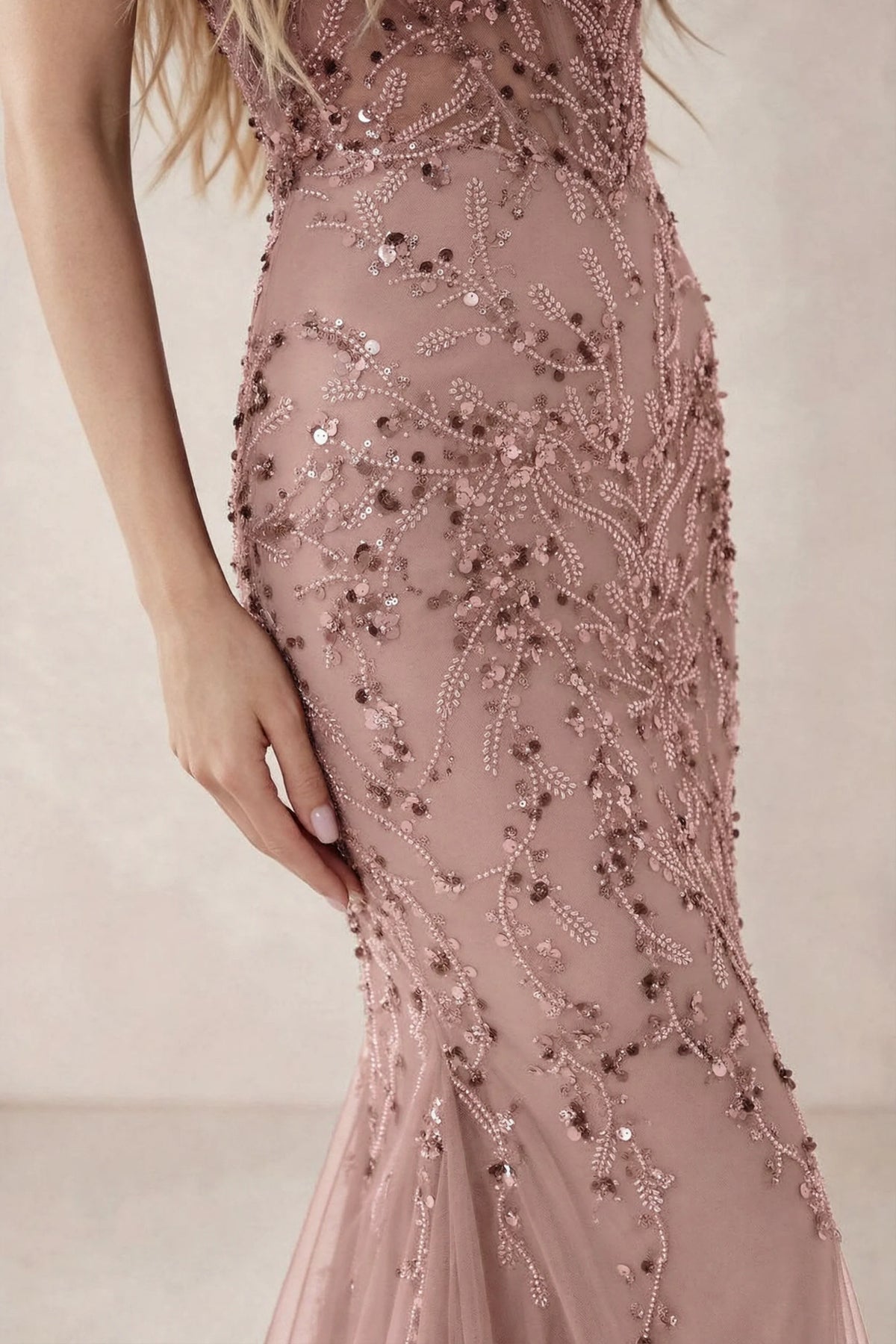 Detail of Aurelia light pink embroidered sequin pattern across the fitted waist and hip