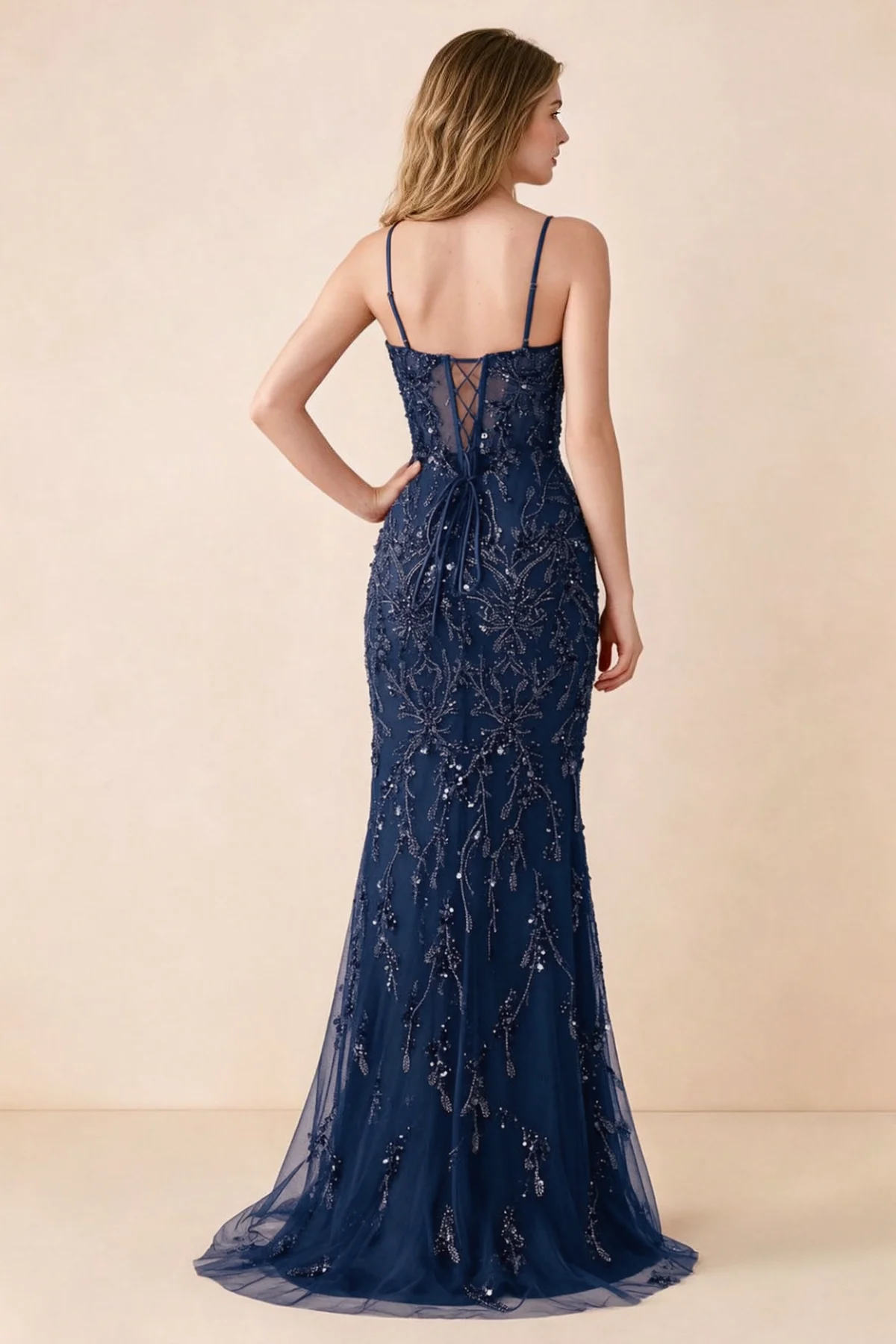 Back view of Aurelia navy maxi dress showing spaghetti straps and crossed waist lacing