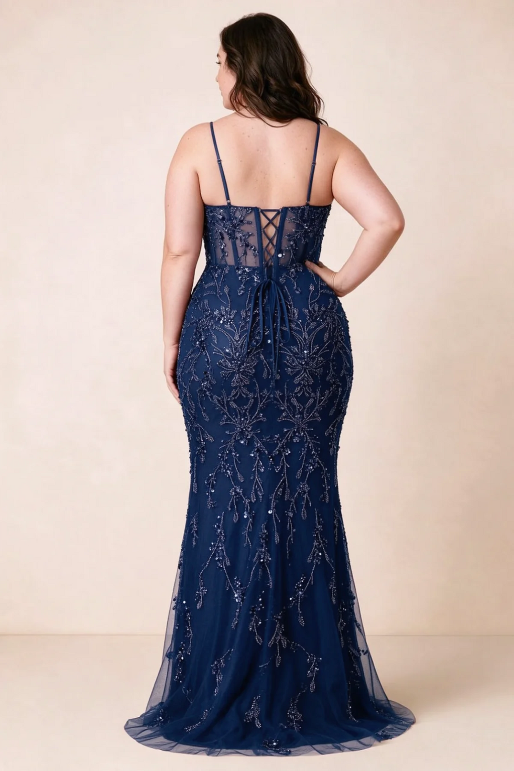 Back view on a second model showing the Aurelia navy corset dress and waist lacing