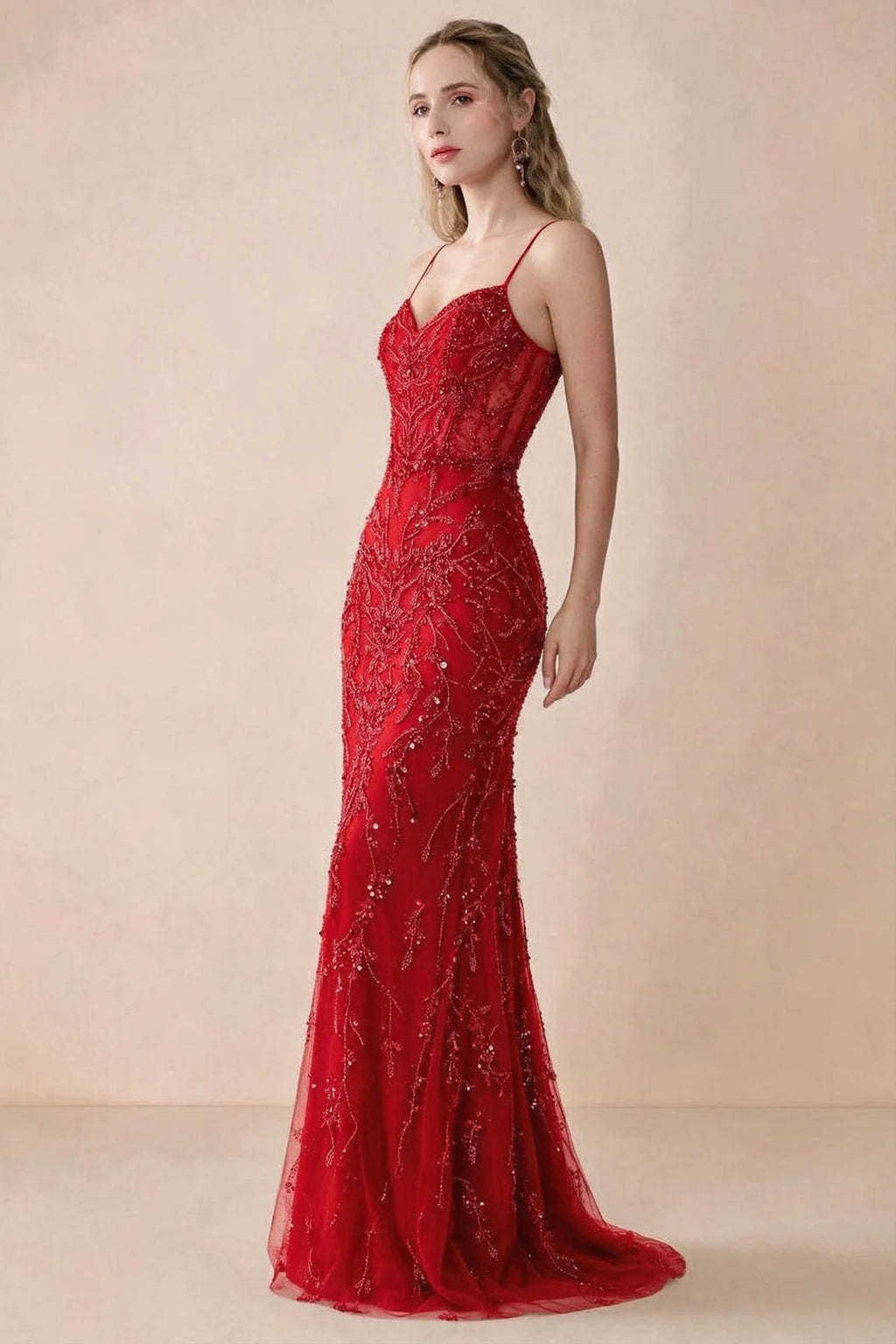 Side view of Aurelia red sequin maxi dress showing the fitted hips and flared hem