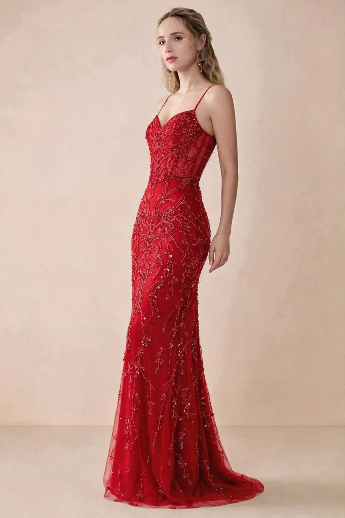 Side view of Aurelia red sequin maxi dress showing the fitted hips and flared hem