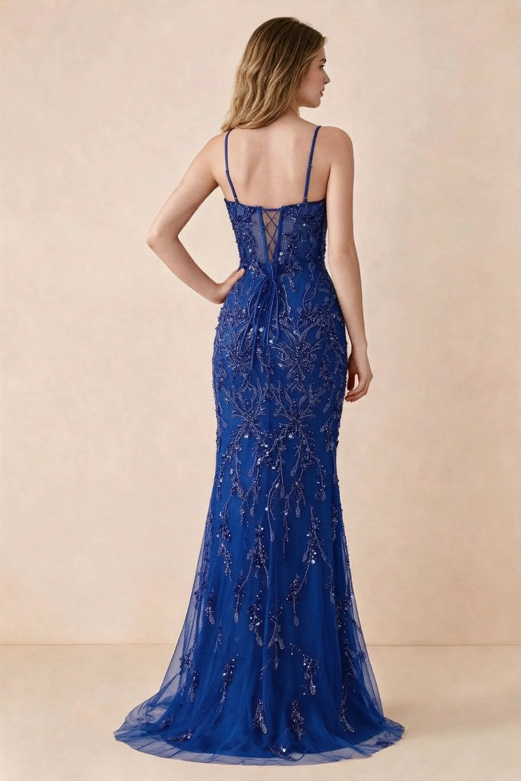 Back view of Aurelia royal blue maxi dress showing spaghetti straps and crossed waist lacing
