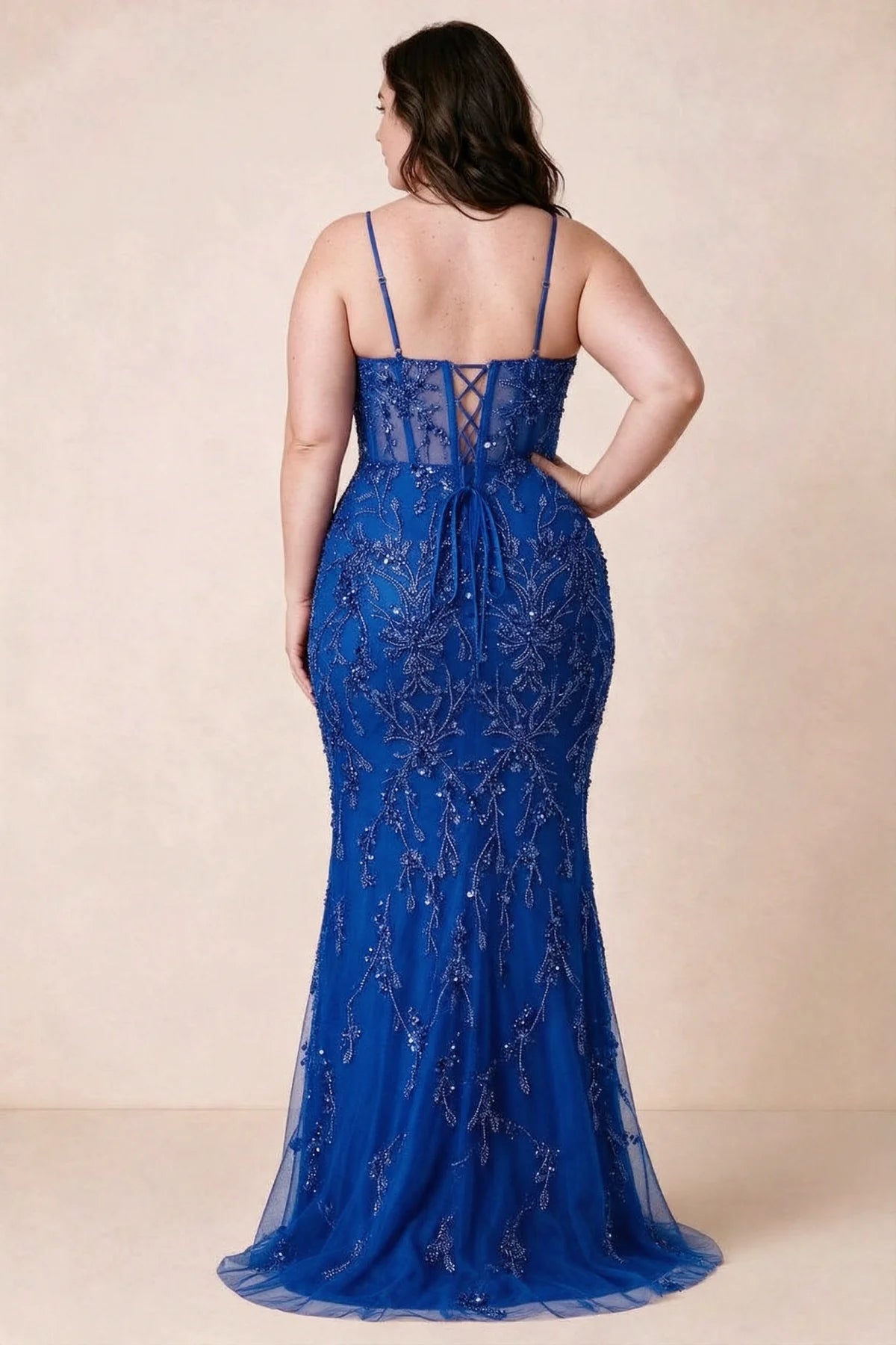 Back view on a second model showing the Aurelia royal blue corset dress and waist lacing