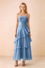 Front view of Ava baby blue chiffon maxi dress with thin straps, a fitted bodice and cascading ruffle tiers