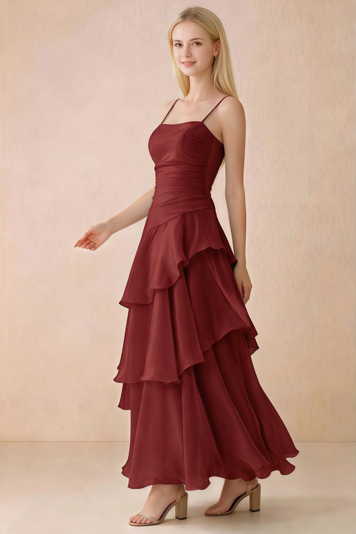 Side view of Ava burgundy maxi dress showing the fitted waist and flared ruffle skirt