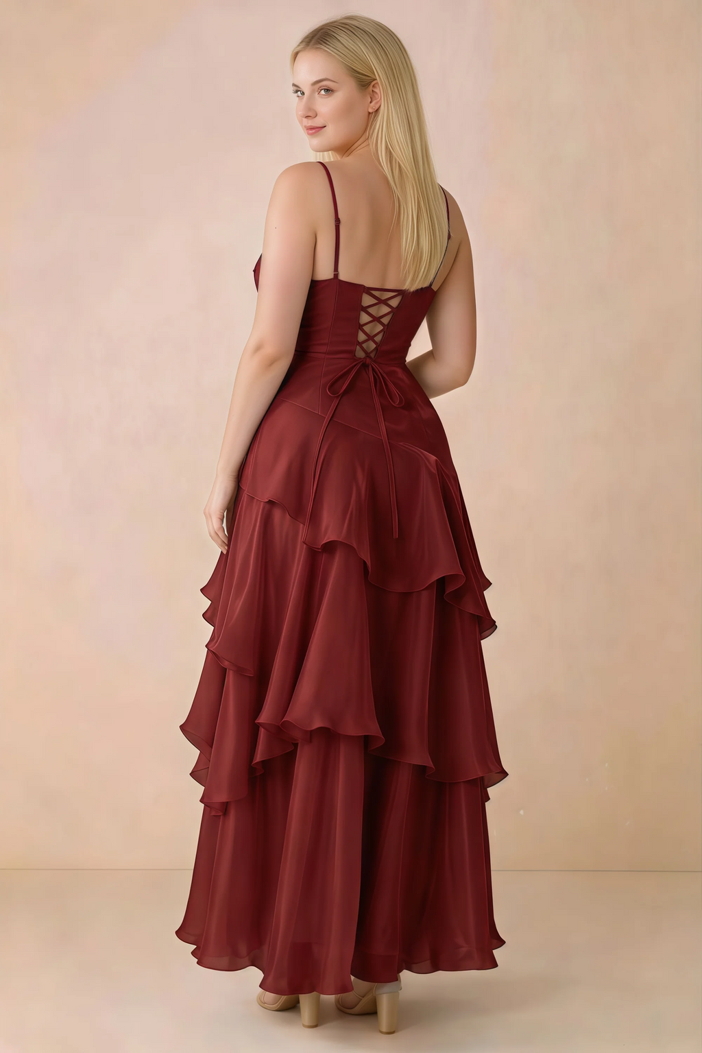 Rear studio view of Ava burgundy maxi dress showing the lace-up bodice and long tiered skirt