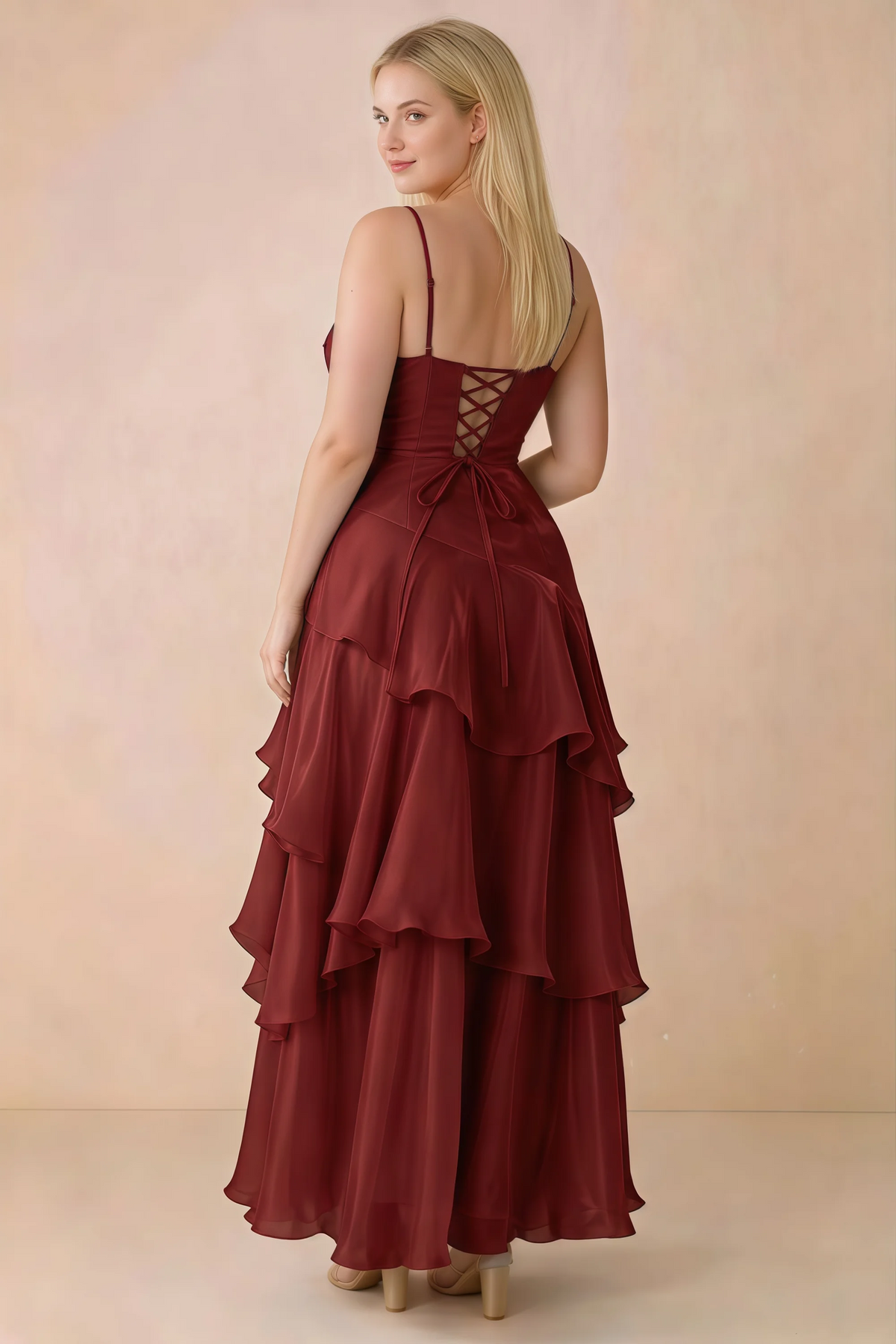 Rear studio view of Ava burgundy maxi dress showing the lace-up bodice and long tiered skirt