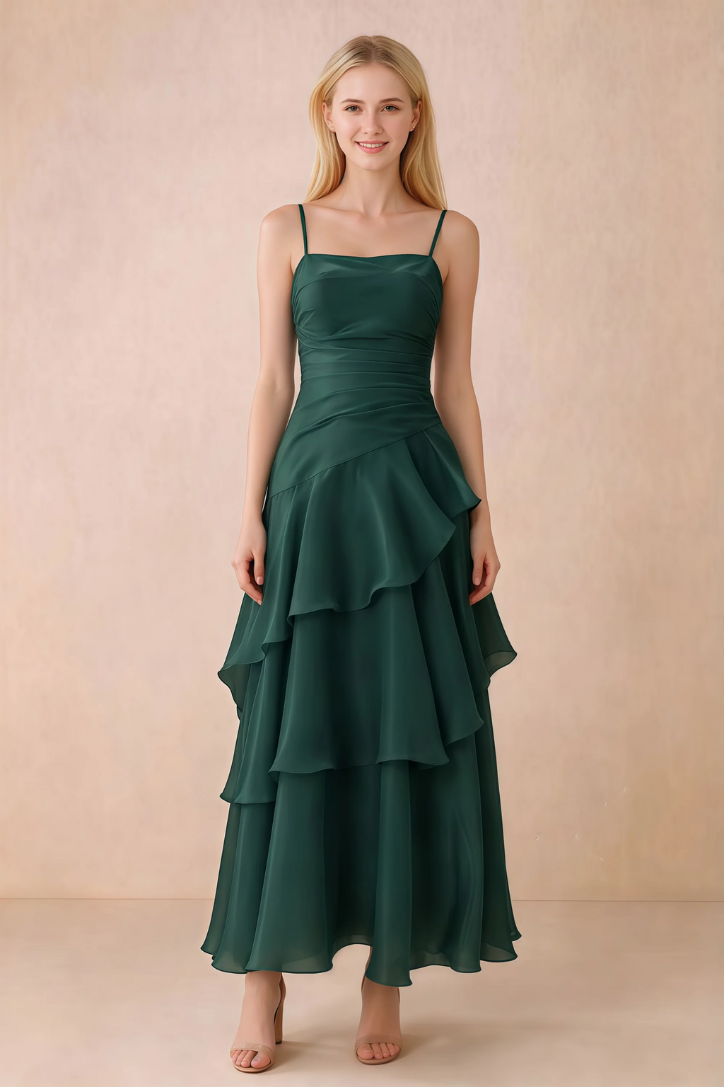 Front view of Ava dark green chiffon maxi dress with thin straps, a fitted bodice and cascading ruffle tiers