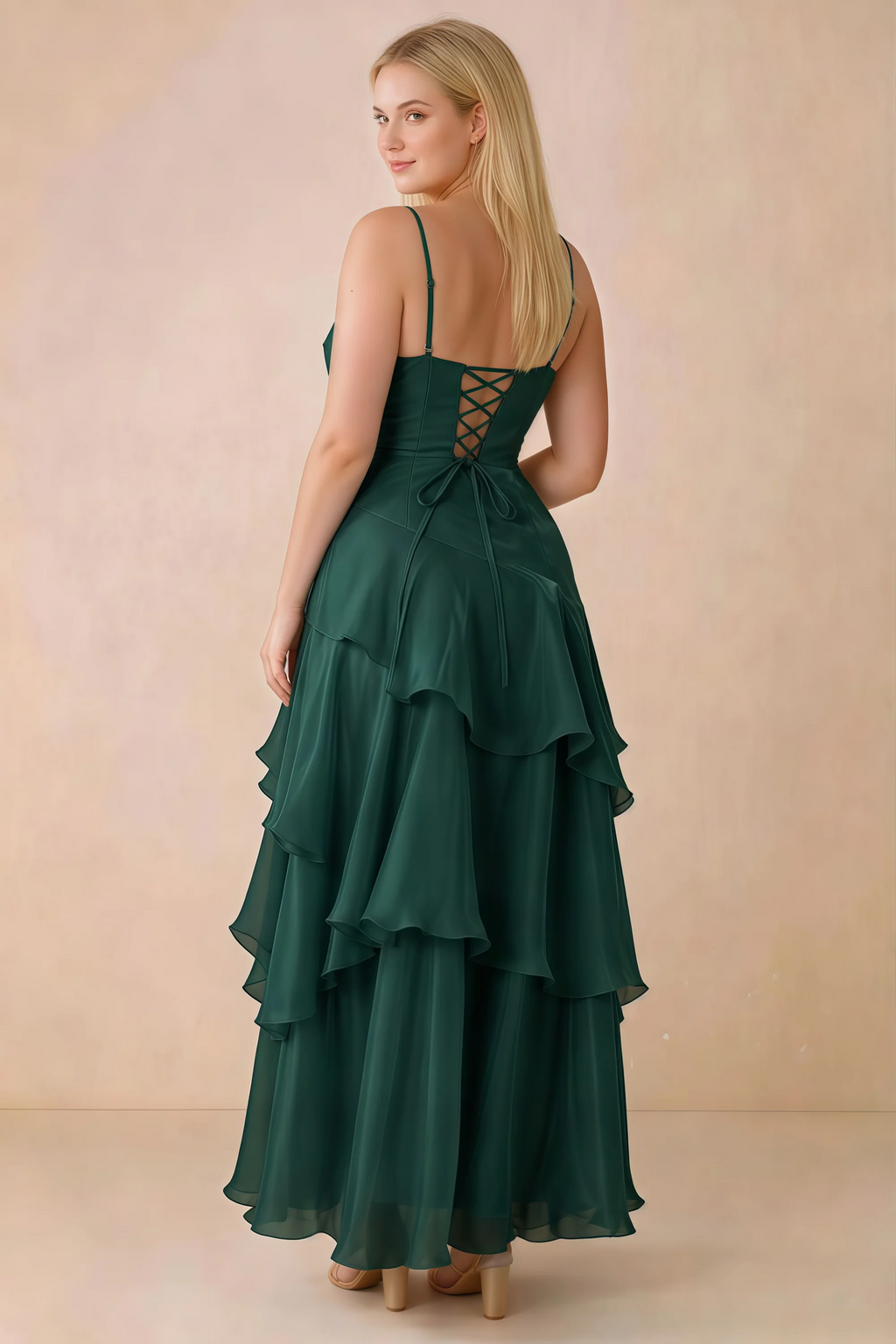 Rear studio view of Ava dark green maxi dress showing the lace-up bodice and long tiered skirt