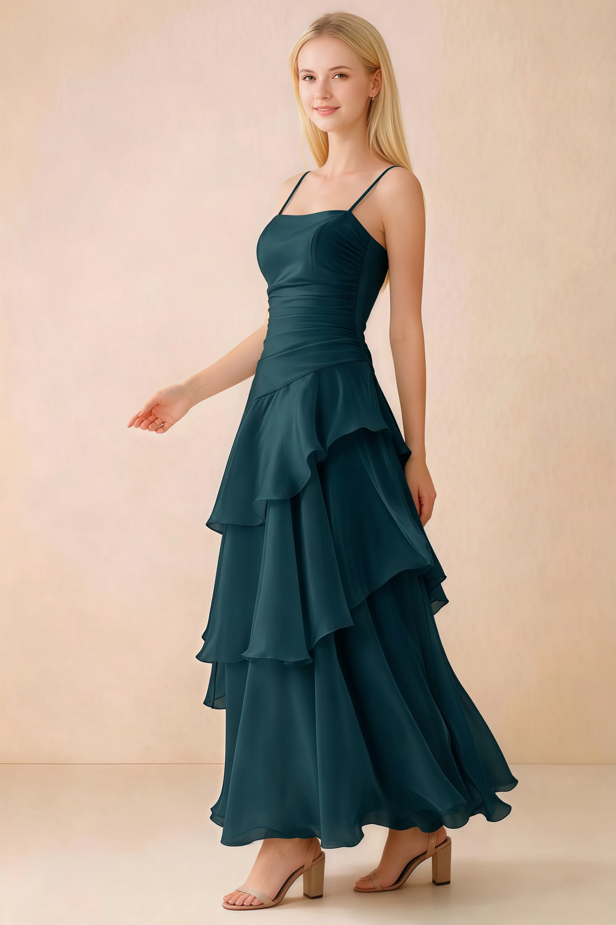 Side view of Ava emerald green maxi dress showing the fitted waist and flared ruffle skirt