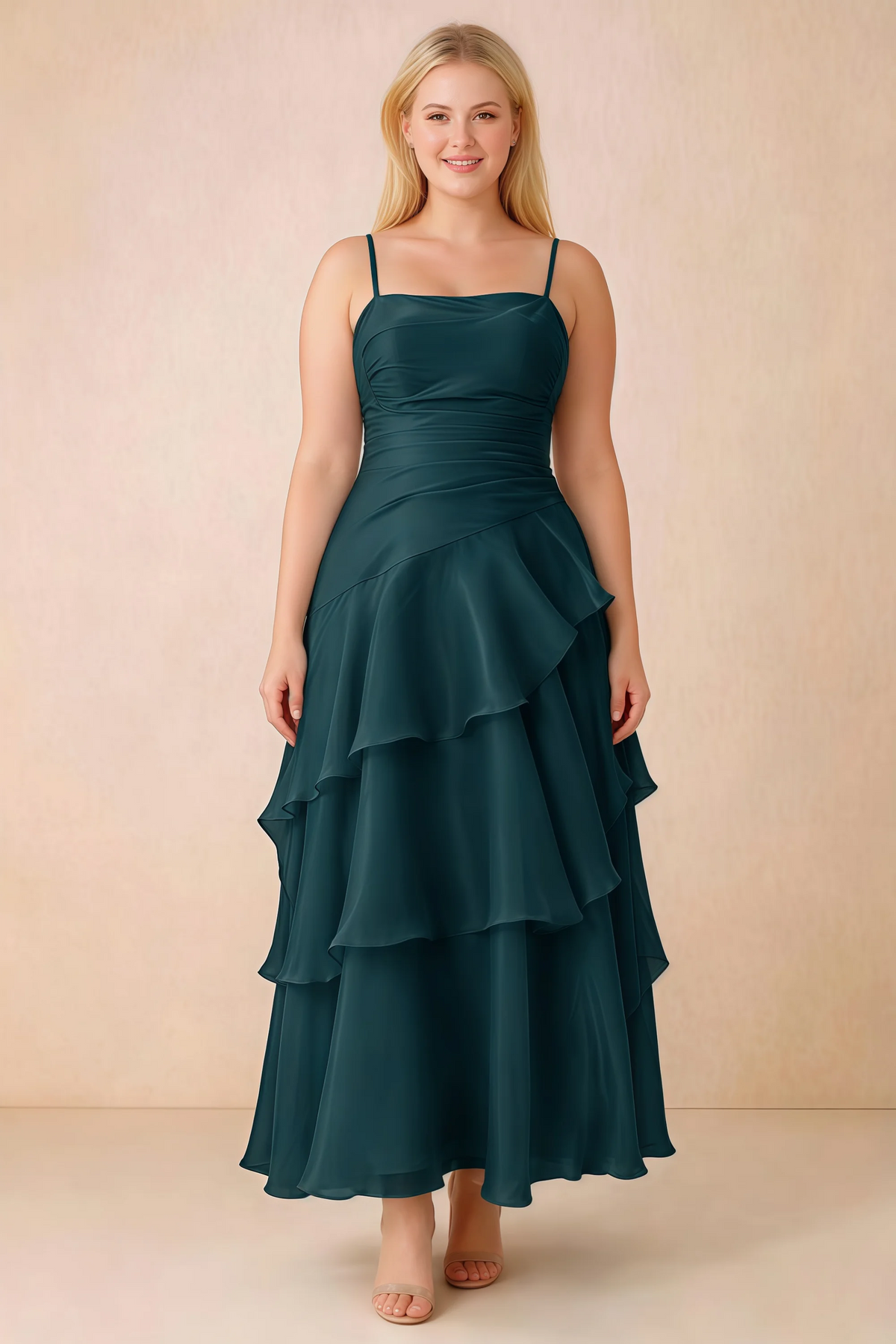 Front studio view of Ava emerald green ruffle dress with a straight neckline and gathered waist