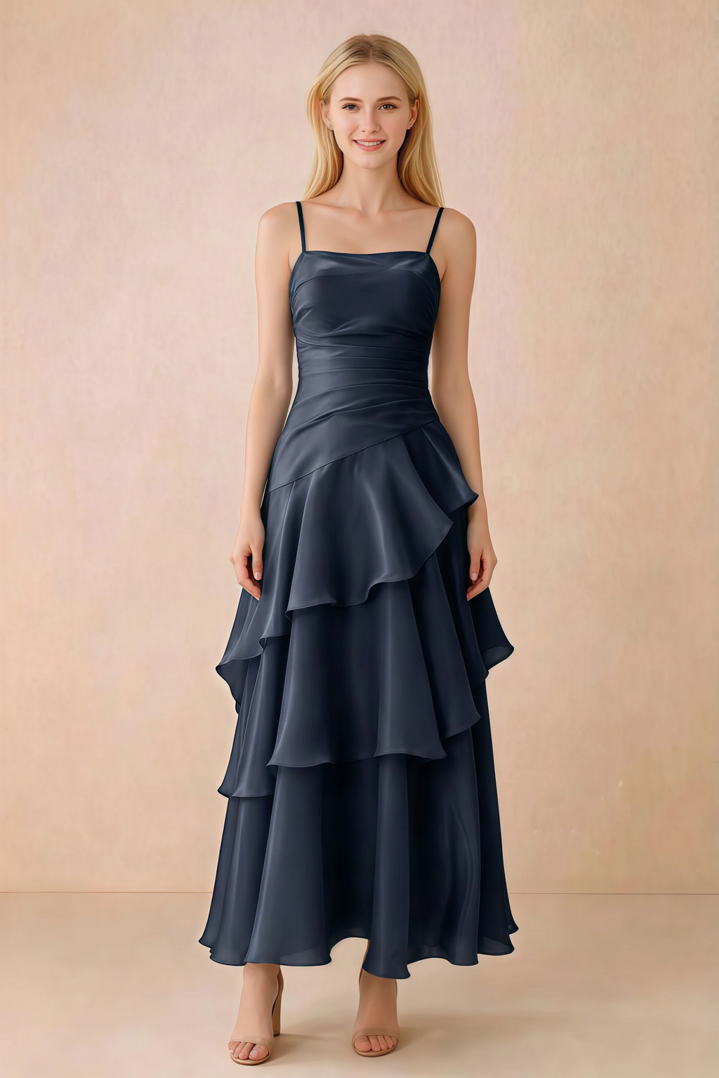 Front view of Ava navy chiffon maxi dress with thin straps, a fitted bodice and cascading ruffle tiers