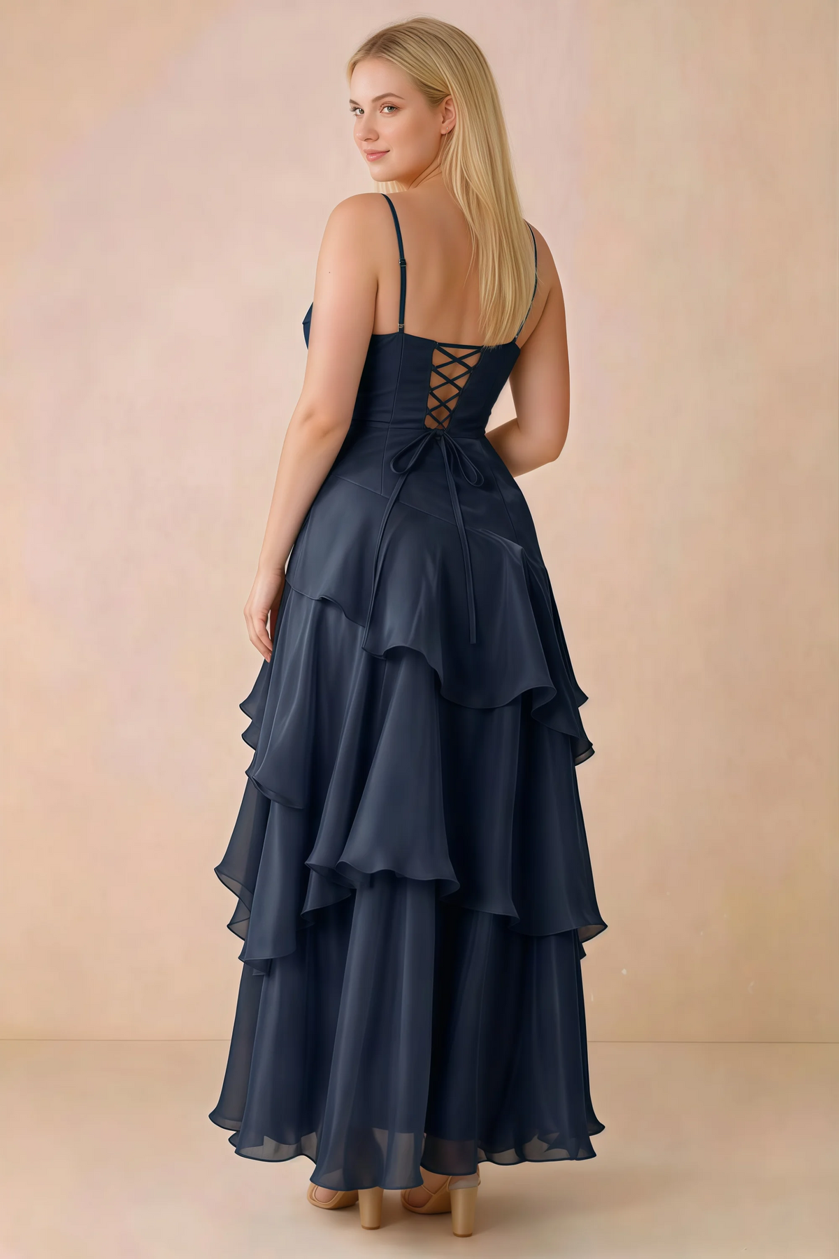 Rear studio view of Ava navy maxi dress showing the lace-up bodice and long tiered skirt