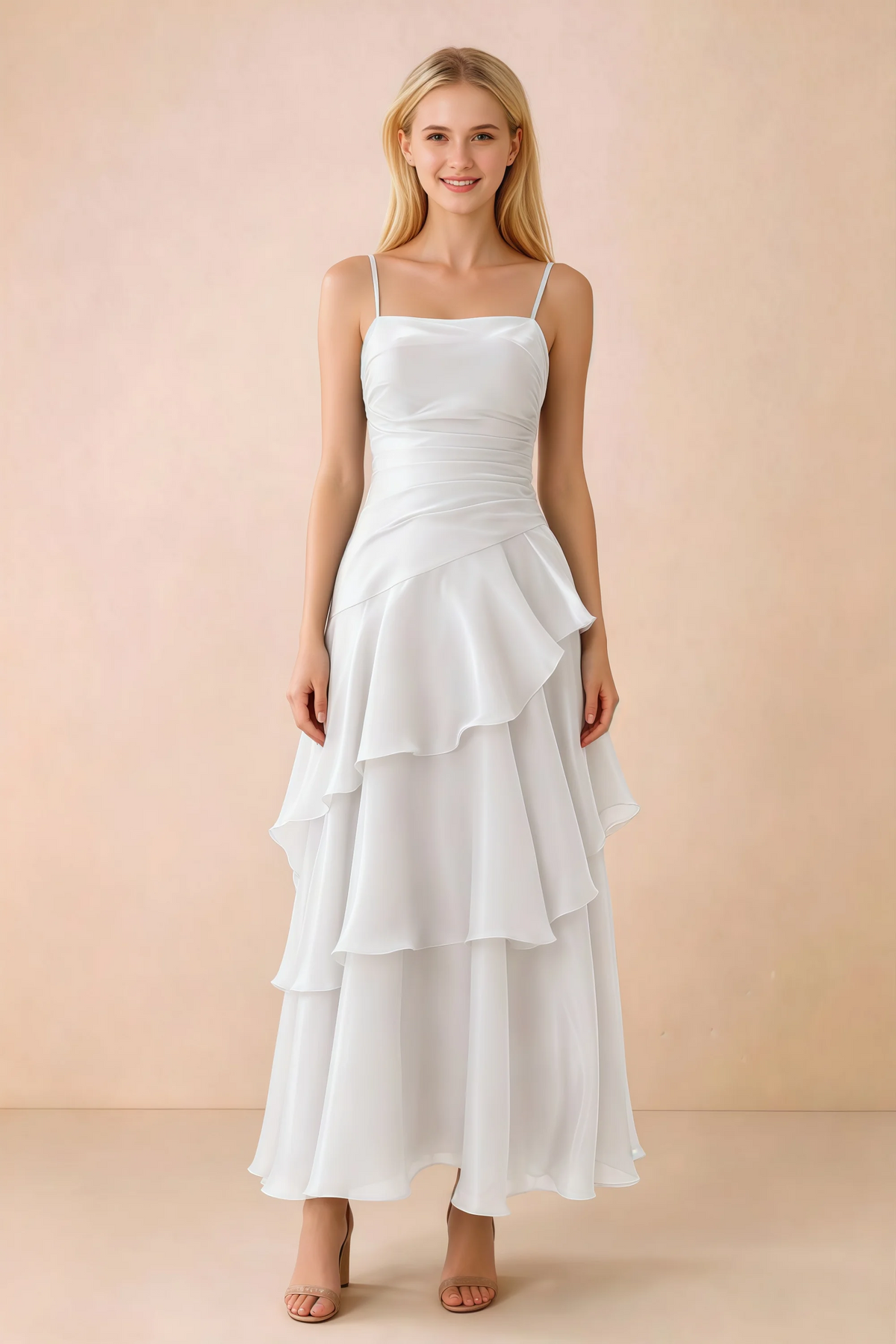 Front view of Ava white chiffon maxi dress with thin straps, a fitted bodice and cascading ruffle tiers