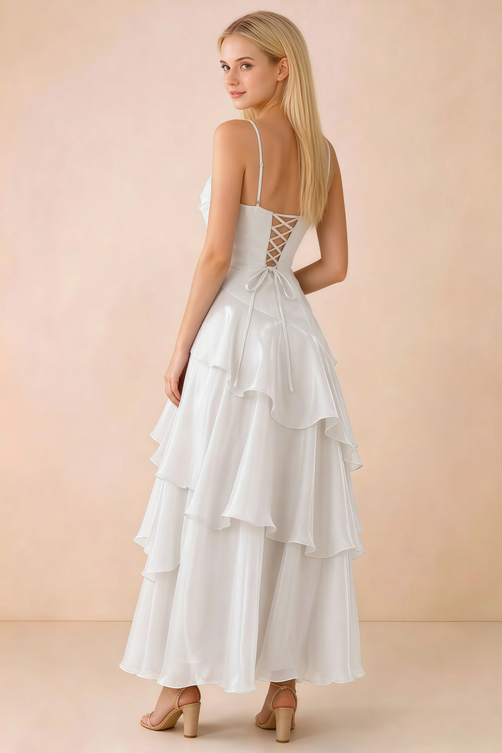 Back view of Ava white tiered ruffle dress showing fine shoulder straps and crossed back lacing